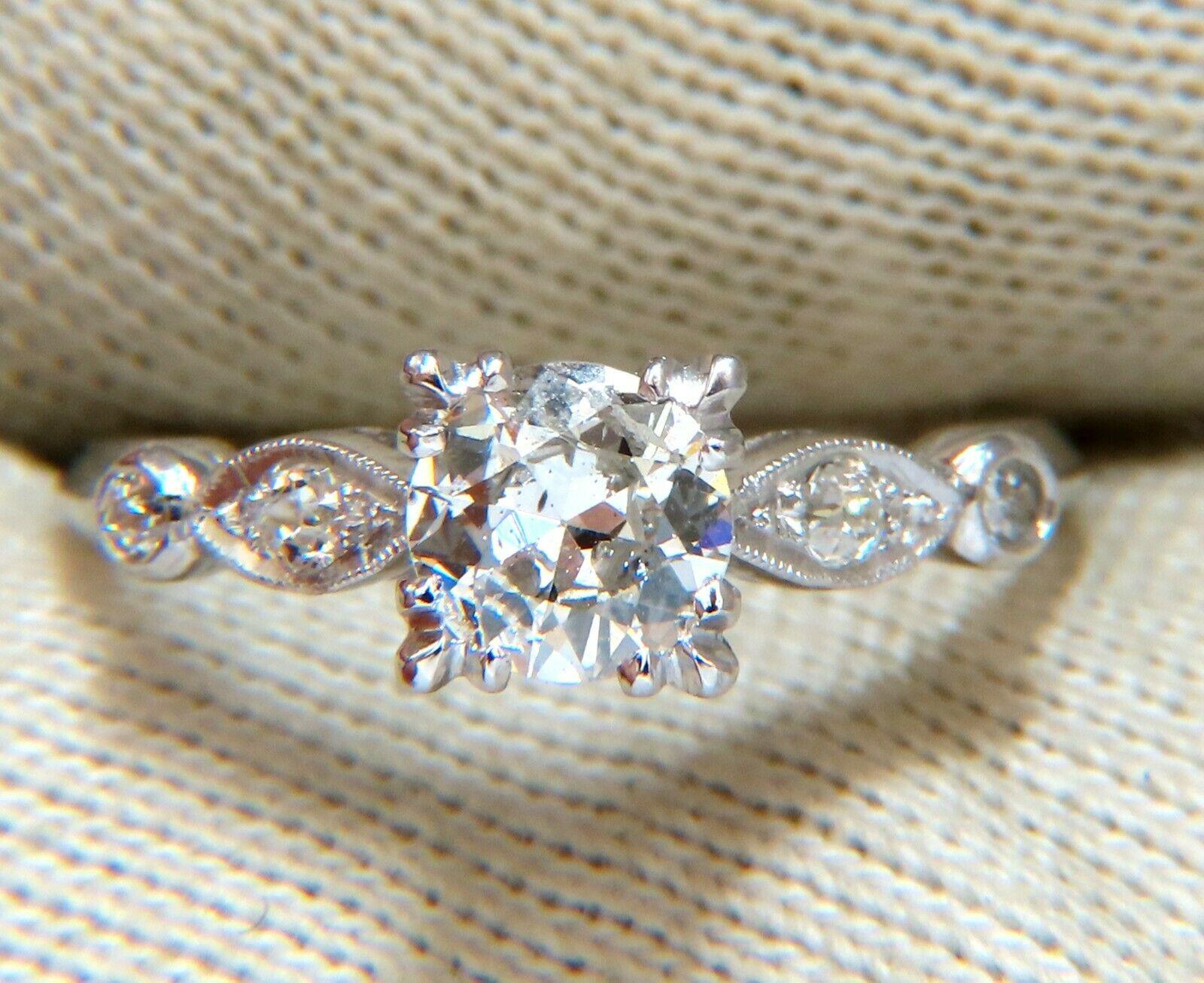 Vintage Elegance

.60ct Natural Round Cut Diamond 

5.8mm diameter

Si-2 clarity I color.

Side round Diamonds: .16ct

G-color Vs-2 Clarity

Platinum

3.4 Grams

Overall ring: 6.4mm wide

Depth: 5.7mm

Current ring size: 7

May professionally