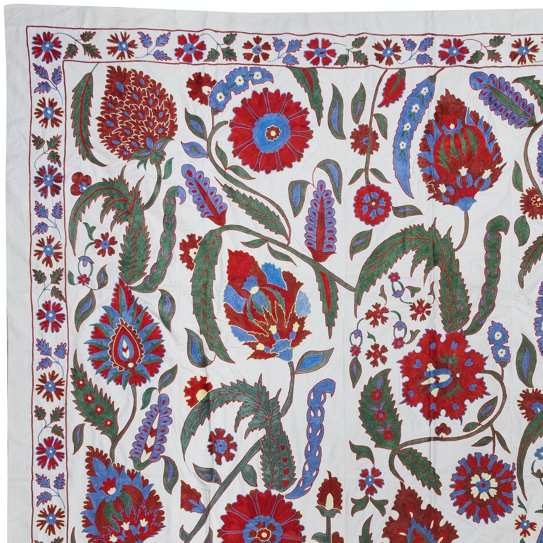 Introducing our exquisite new suzani hand embroidered wall hanging, a captivating piece that combines ancient craftsmanship with modern artistry. This embroidered cloth is not just a suzani throw, but a remarkable suzani wall hanging that will