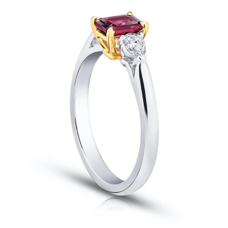 .77 Carat Emerald Cut (natural no heat) Red Ruby with 2 pear shape diamonds .27 carats set in a platinum and 18k yellow gold ring.
