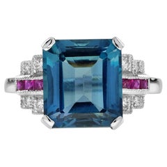 7.7 Ct. London Blue Topaz Ruby Diamond Art Deco Style Engagement Ring in 9K Gold