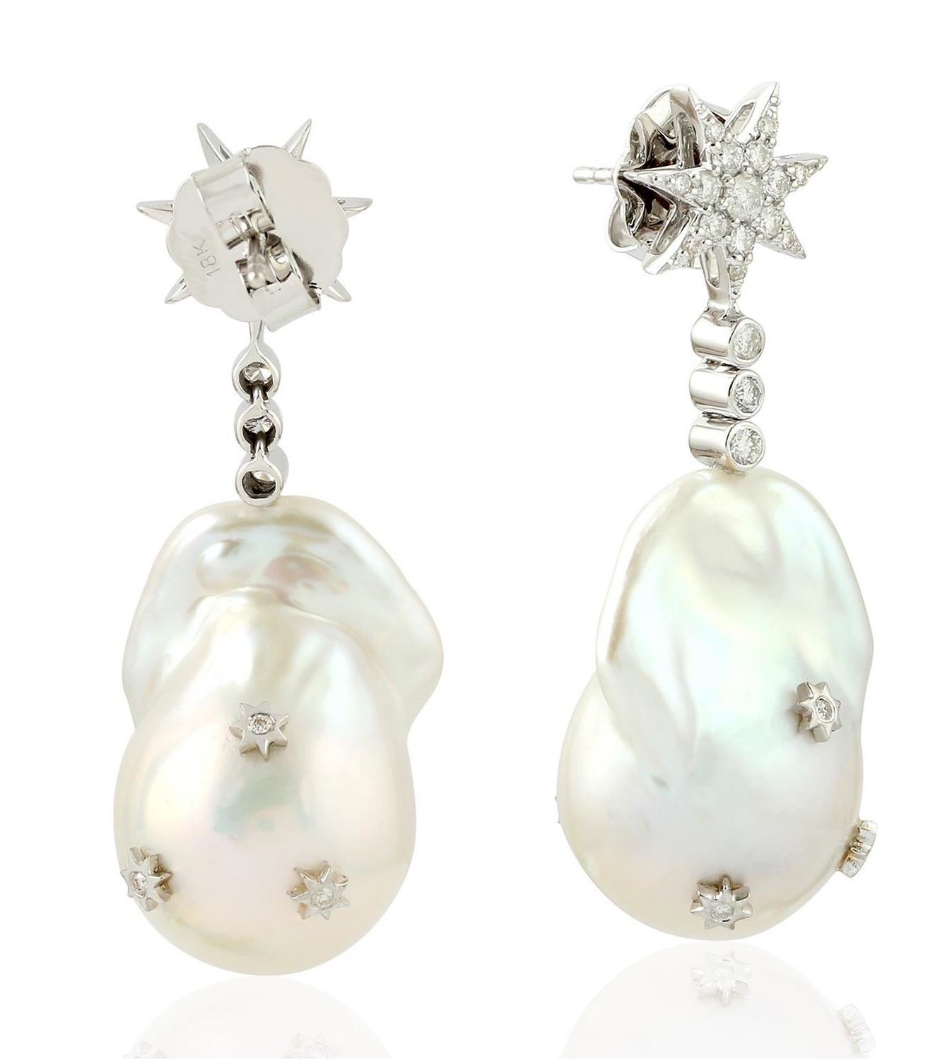 These stunning star pearl earrings are thoughtfully and meticulously crafted with   
18 Karat white gold.  It is set with 77.0 carats of pearl and .80 carats of sparkling white diamonds.

FOLLOW  MEGHNA JEWELS storefront to view the latest