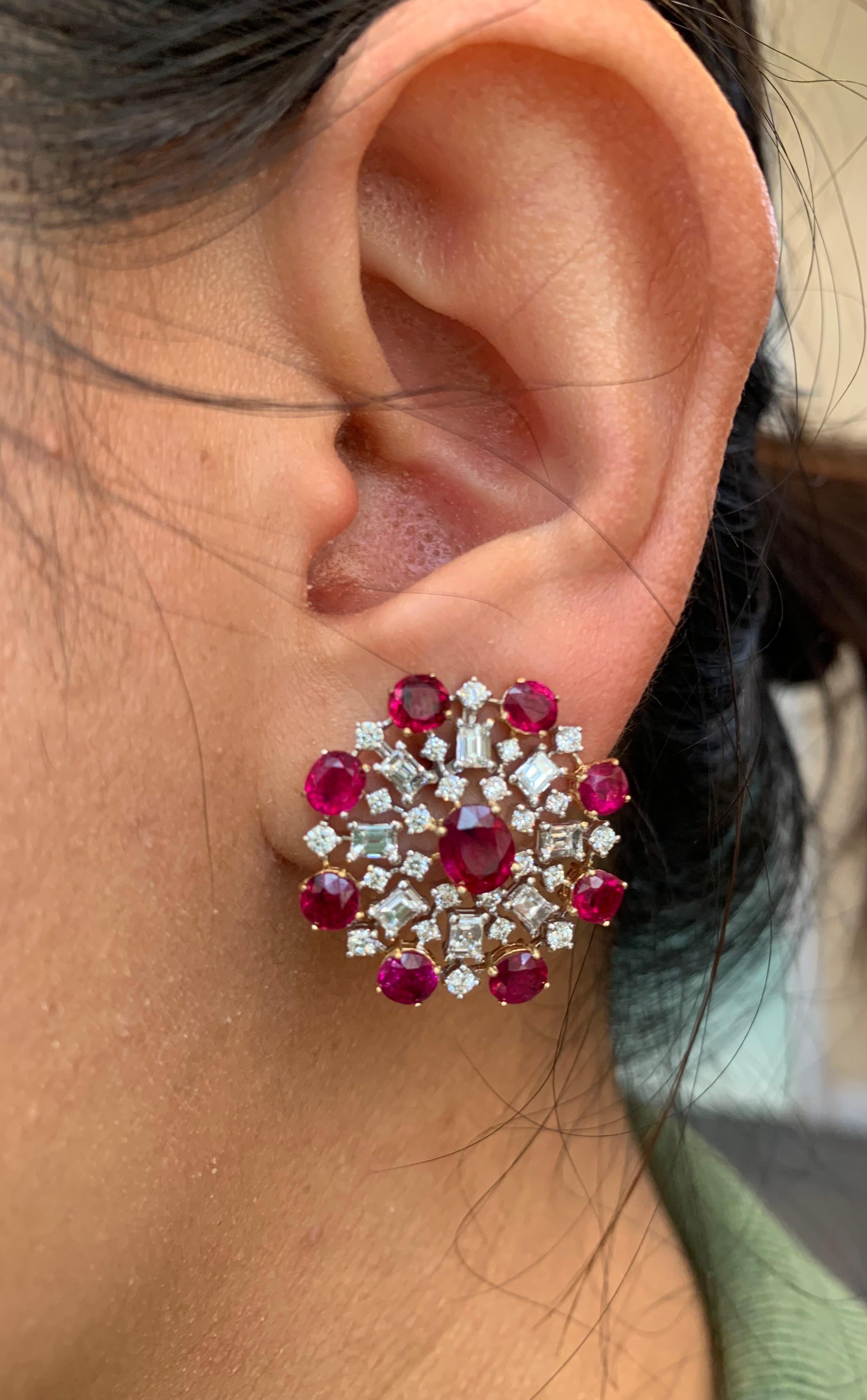 The unique and vibrant ruby and diamond earrings are handcrafted by Rewa jewels in 18 karat white gold.

The main highlights are the 2 centre pieces, untreated Burmese rubies weighing approximately 1.35 carat in all.
Decorated with 16 pieces of