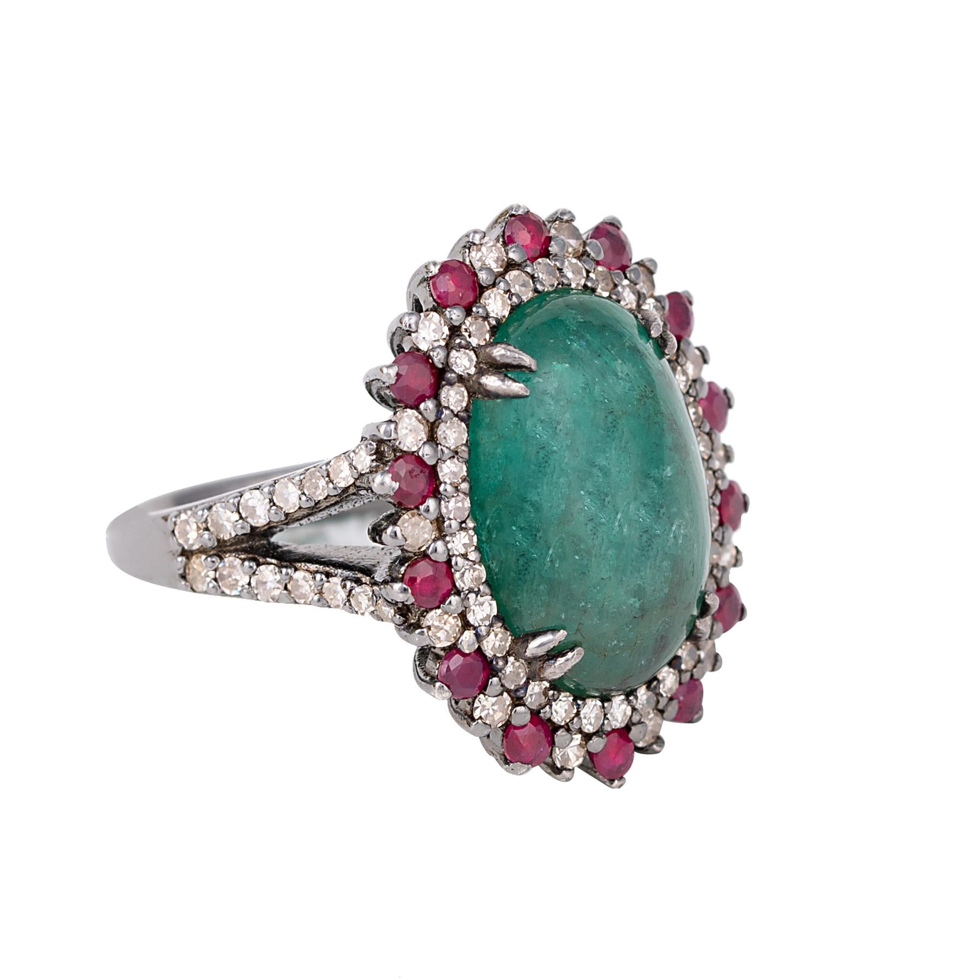 7.70 Carat Cabochon-Cut Emerald, Diamond, and Ruby Cocktail Ring in Art-Deco Style

This Victorian era art-deco style enchanting forest green emerald, brick red ruby and diamond ring is ravishing. The solitaire oval emerald cabochon in double-eagle