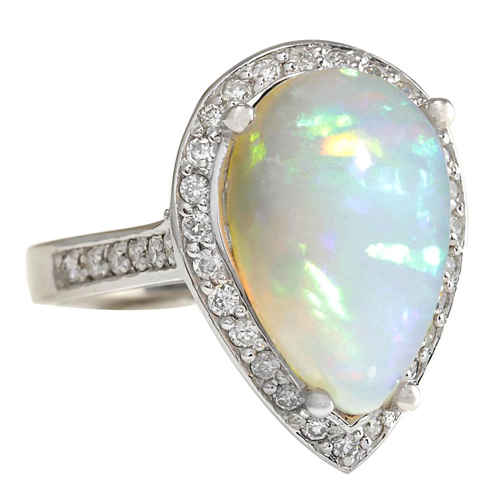 7.70 Carat Natural Opal 14 Karat White Gold Diamond Ring
Stamped: 14K White Gold
Total Ring Weight: 9.2 Grams
Total Natural Opal Weight is 6.74 Carat (Measures: 17.00x11.00 mm)
Total Natural Diamond Weight is 0.96 Carat
Color: F-G, Clarity: