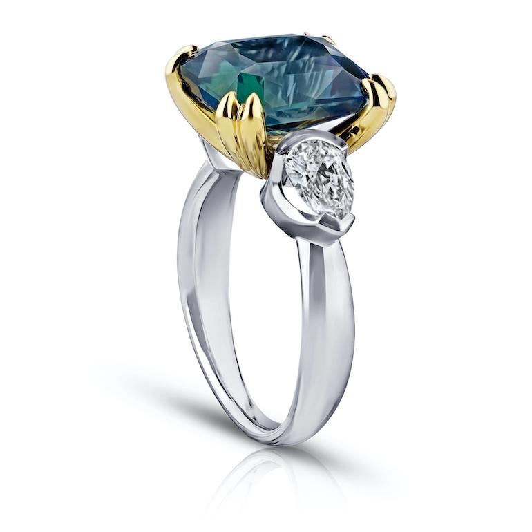 7.70 carat radiant cut (natural no heat) green sapphire with pear shape diamonds 1.05 carats set in a platinum with 18k yellow gold ring.