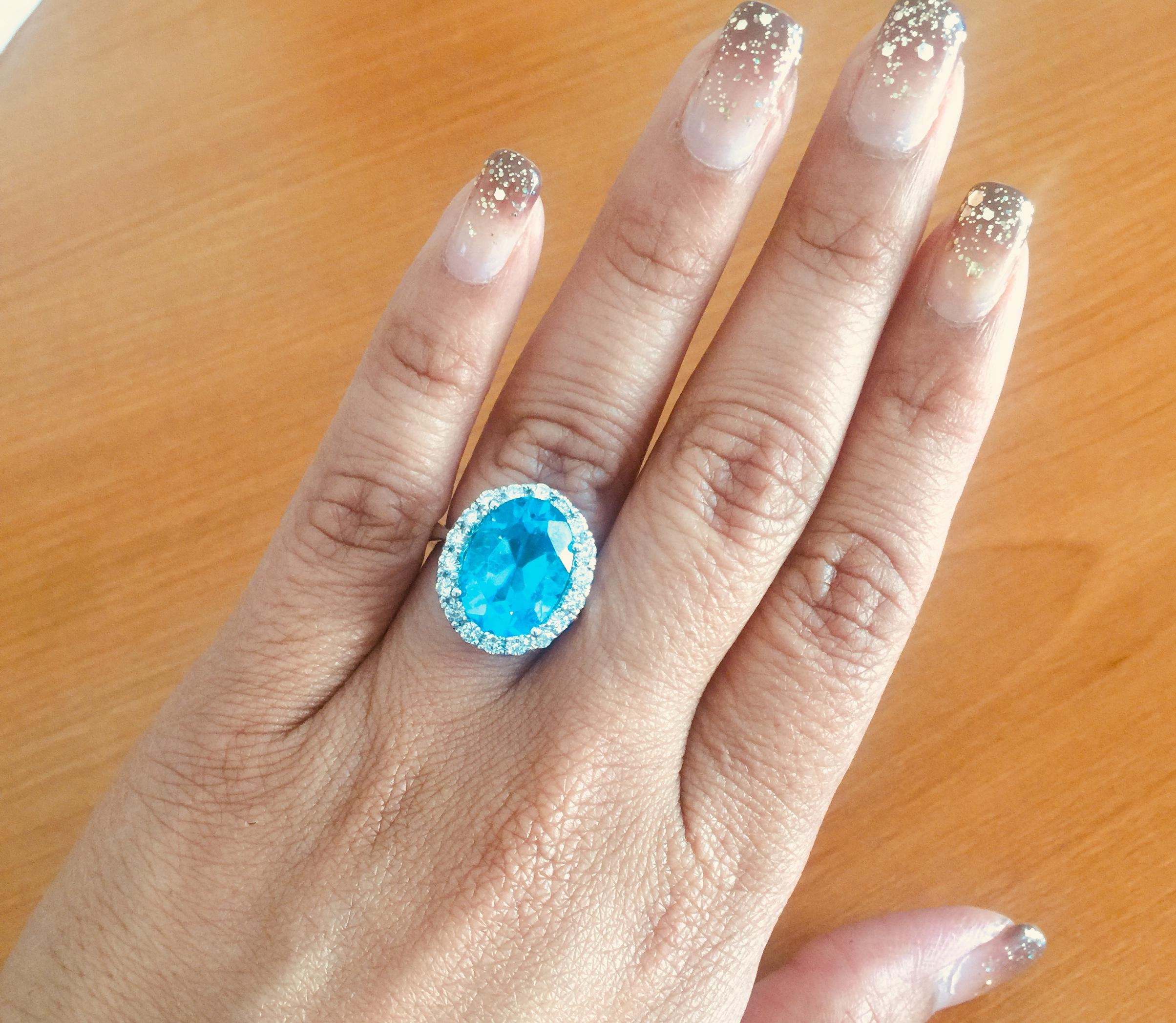 Modern 7.72 Carat Blue Topaz Halo Diamond Ring