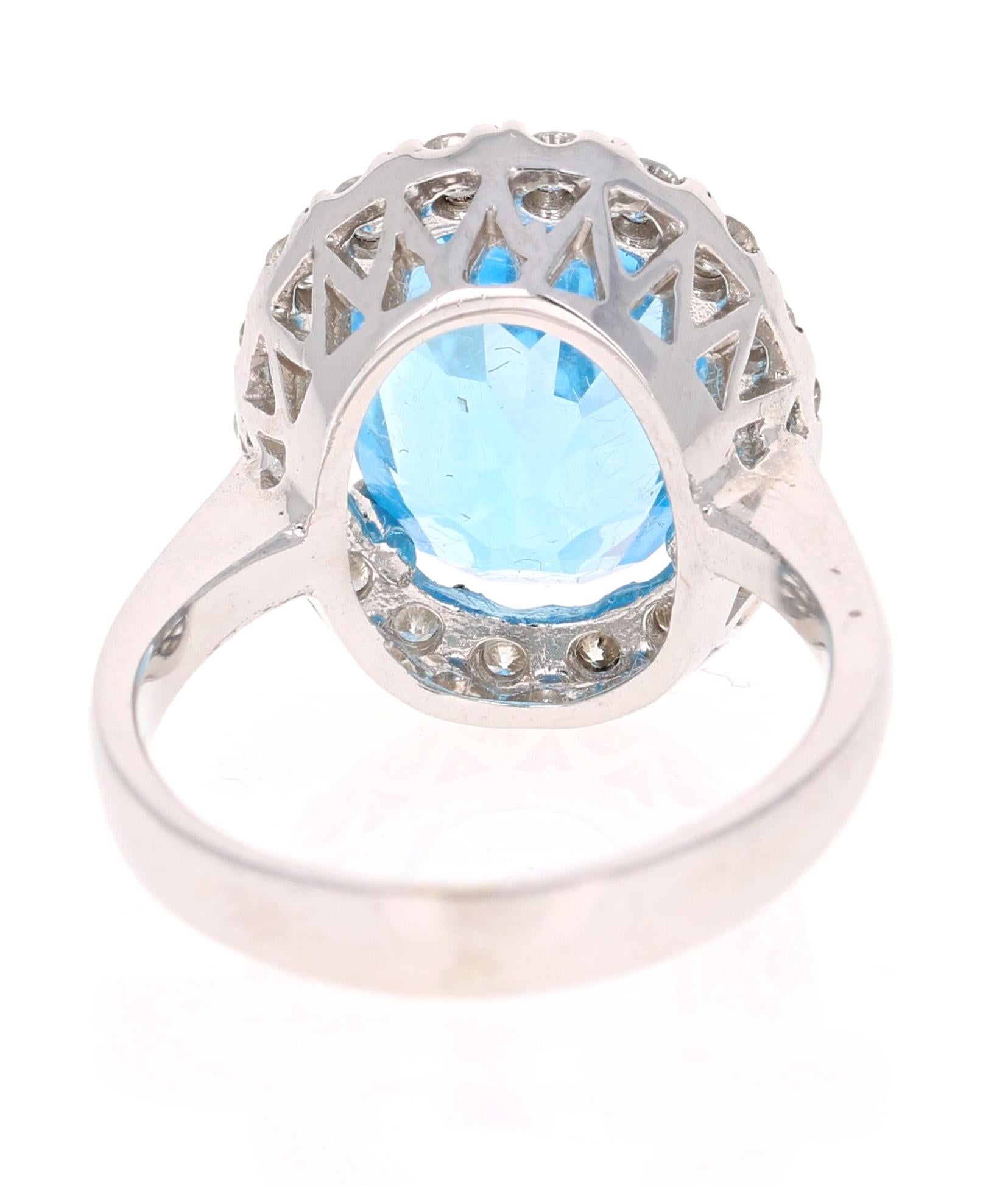Oval Cut 7.72 Carat Blue Topaz Halo Diamond 4 Karat White Gold Ring For Sale