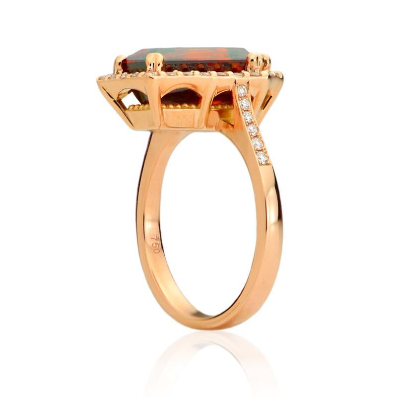 This one of a kind* Contemporary 18k Rose Gold Ring from the St-Onge Colosseum Collection is adorned with a 7.72 carats kite-shaped Fiery Orange Spessartite garnet and surrounded with a halo of 25 round brilliant cut diamonds and 6 diamonds on each