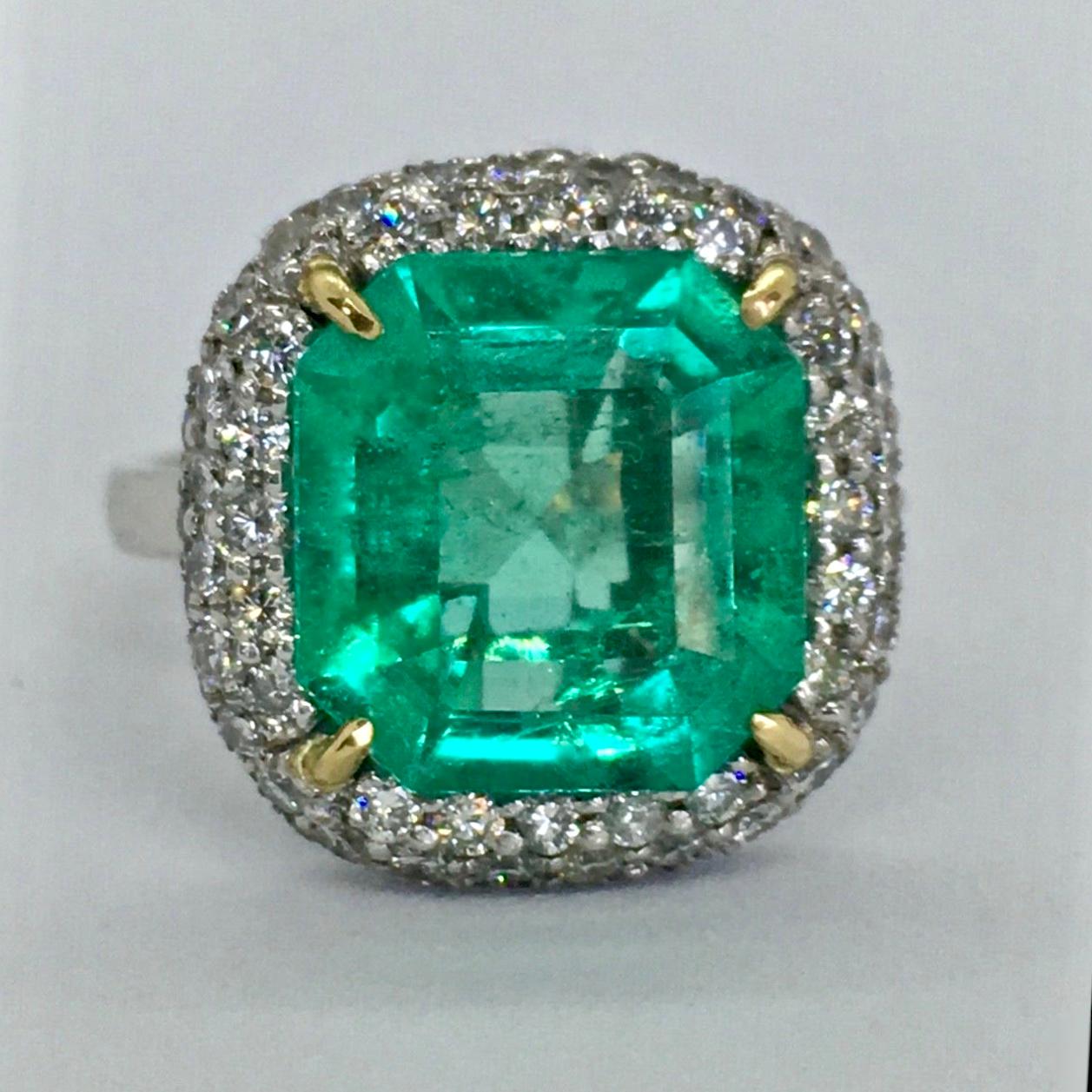 Stunning Extra Fine Natural Colombia Emerald, Diamond and 18K white Gold handmade Engagement Ring from our Workshop.
Fine Natural Colombian Emerald octagonal faceted 5.73 Carats
12.60mm x 11.85mm x 6.30mm
Color: AAAA vivid medium green 
Saturation: