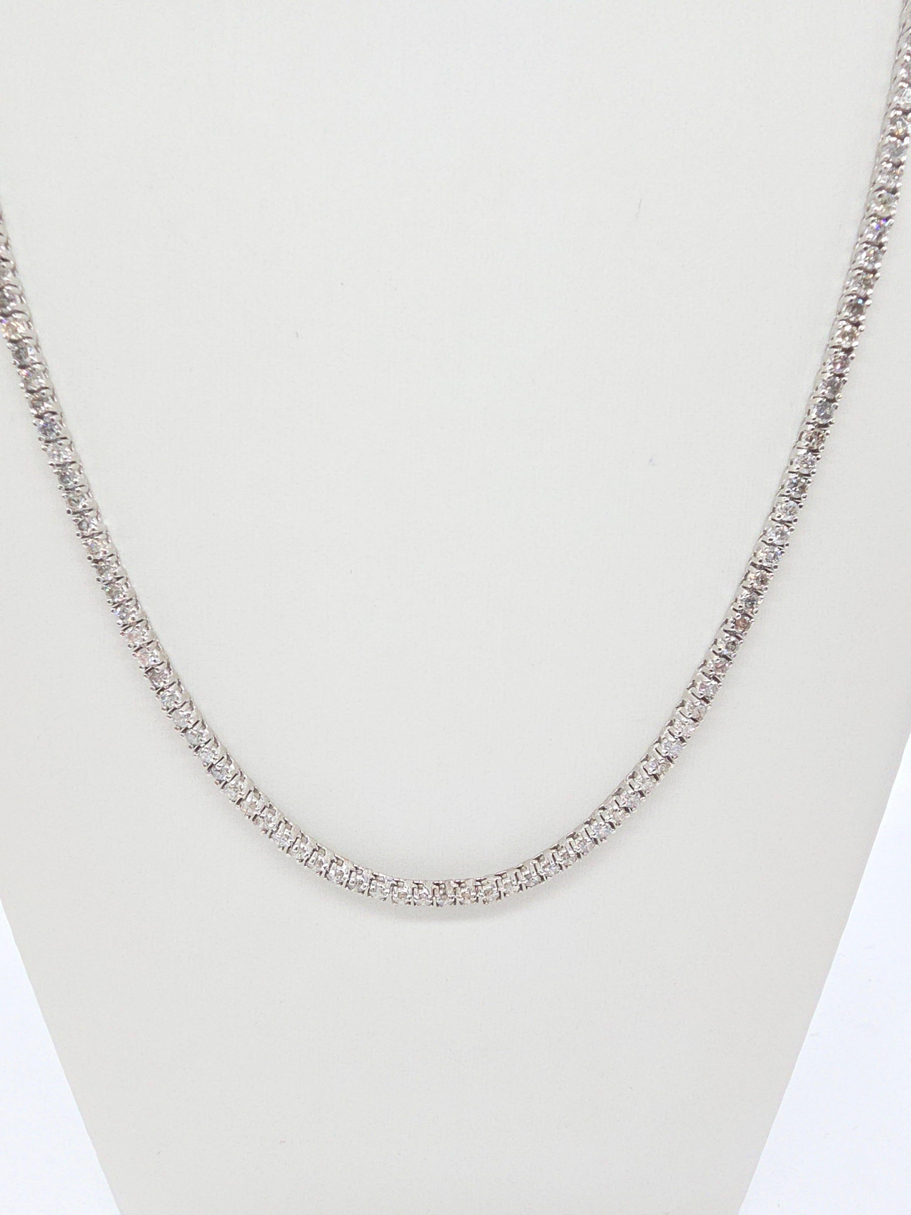 Elegant Tennis Necklace with Round-Brilliant Cut White Diamonds

This luxurious tennis necklace showcases round-brilliant cut white diamonds, renowned for their exceptional sparkle and brilliance. With a classic four-prong setting, the necklace