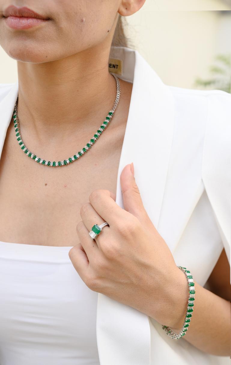 Genuine Emerald Diamond Tennis Necklace in 18K Gold studded with oval cut emeralds and mix cut diamonds. This stunning piece of jewelry instantly elevates a casual look or dressy outfit. 
Emerald enhances intellectual capacity of the
