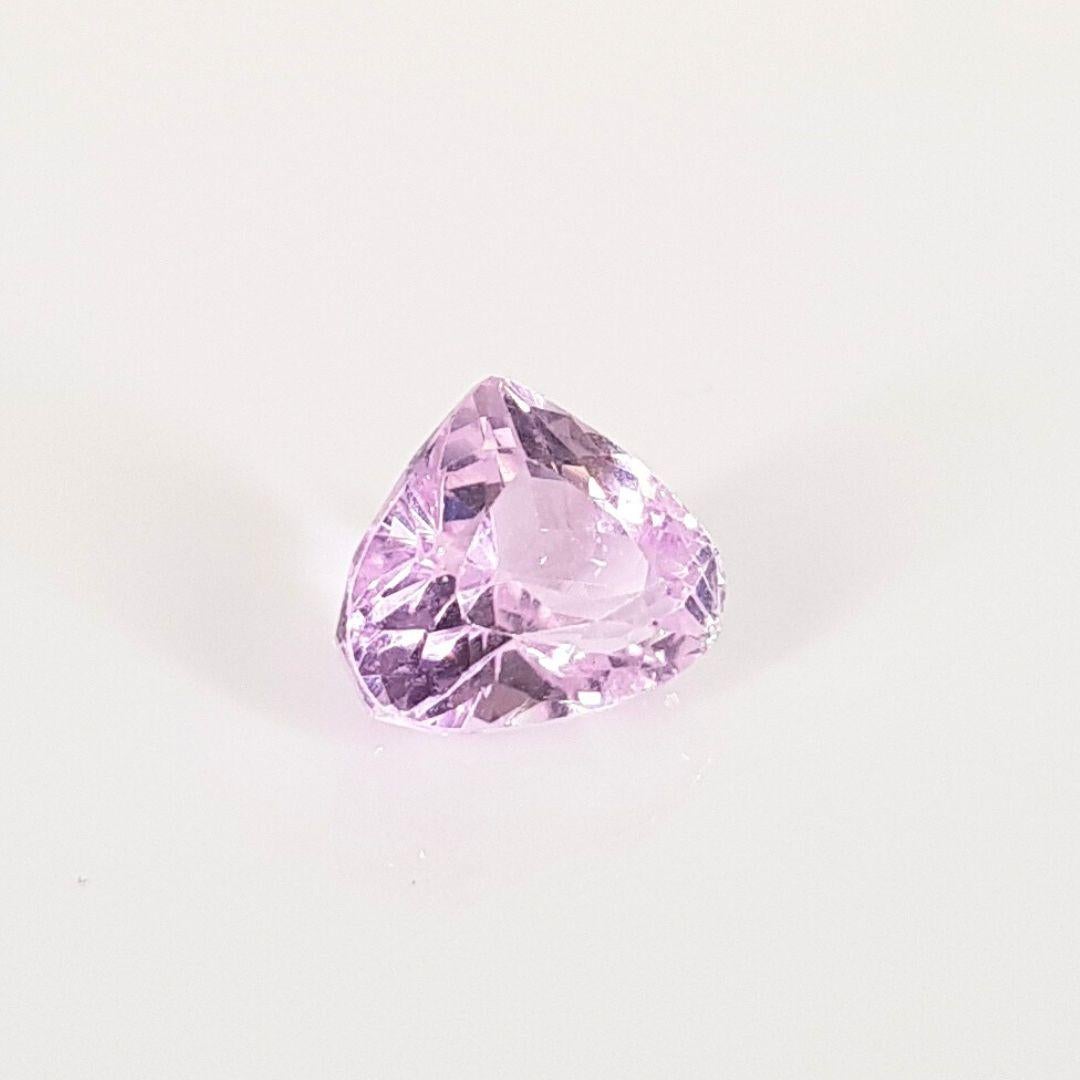 Natural Kunzite Spodumene gemstone: Delicate pink-violet beauty, known for its serene energy and elegance, cherished in fine jewelry.
Carat Weight:		             7.74CT
Cut: 			              Pear
Dimensions (estimated):	10.91mm x 12.83mm x