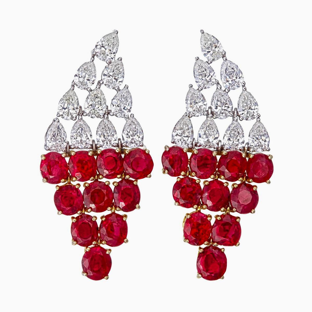 These luxurious ruby and diamond earrings are handcrafted by Rewa jewels in 18 karat white gold.

The main highlights are the 20 pieces untreated Burmese rubies weighing approximately 7.75 carat in all.

Additionally it has 20 pieces of pear shaped