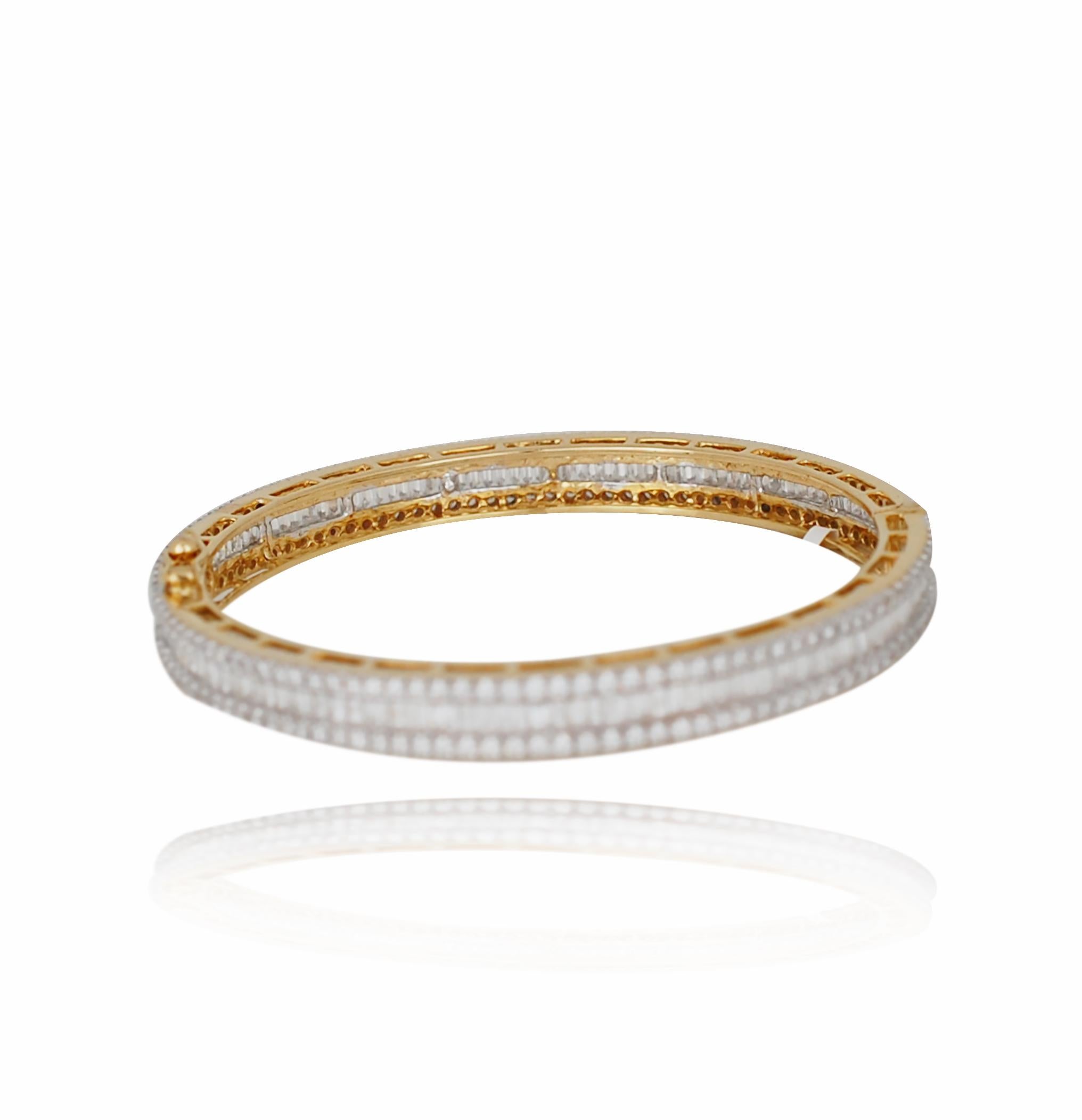 A classic diamond cuff can be seen below with over 7.75 carats of bright white E-F VS.  This baguette has both baguette and round brilliant cut diamonds.  The bracelet has a gorgeous white look with edges of yellow accented 18k gold.  The bracelet