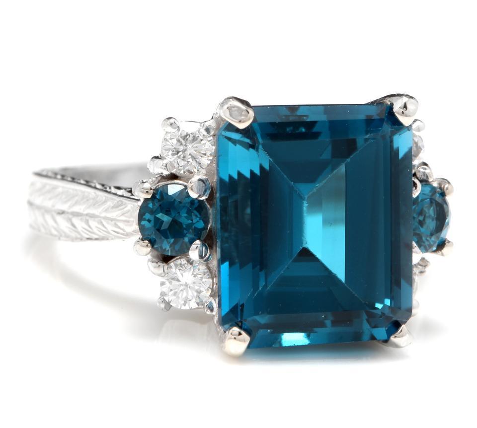 7.75 Carats Natural London Blue Topaz and Diamond 14K Solid White Gold Ring

Total Natural Topaz Weight: Approx. 7.45 Carats

Center Emerald Cut Topaz Weight: Approx. 7.00 Carats

Center Topaz Measures: Approx. 12.00mm x 10.00mm

Natural Round