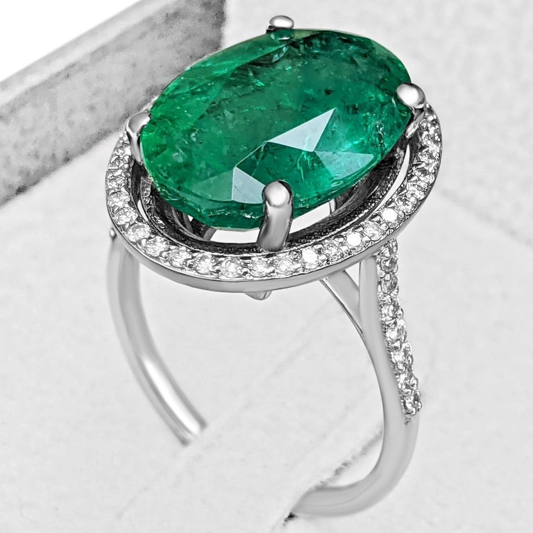 Oval Cut 7.76 Carat Natural Emerald and 0.35 Ct Diamonds, 18 Kt. White Gold, Ring