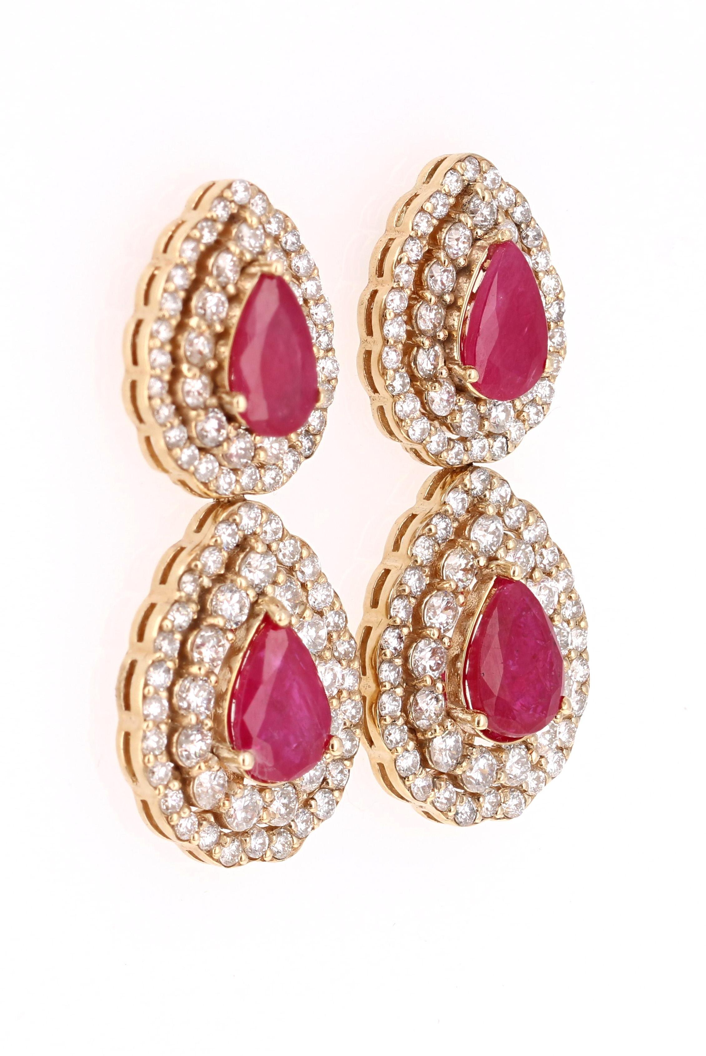 These earrings have 4 Natural Pear Cut Rubies that weigh 4.59 Carats. They are surrounded by 164 Round Cut Diamonds that weigh 3.18 Carats. (Clarity: SI, Color: F)

The Rubies are natural and have been heat treated as per industry standards. 

They
