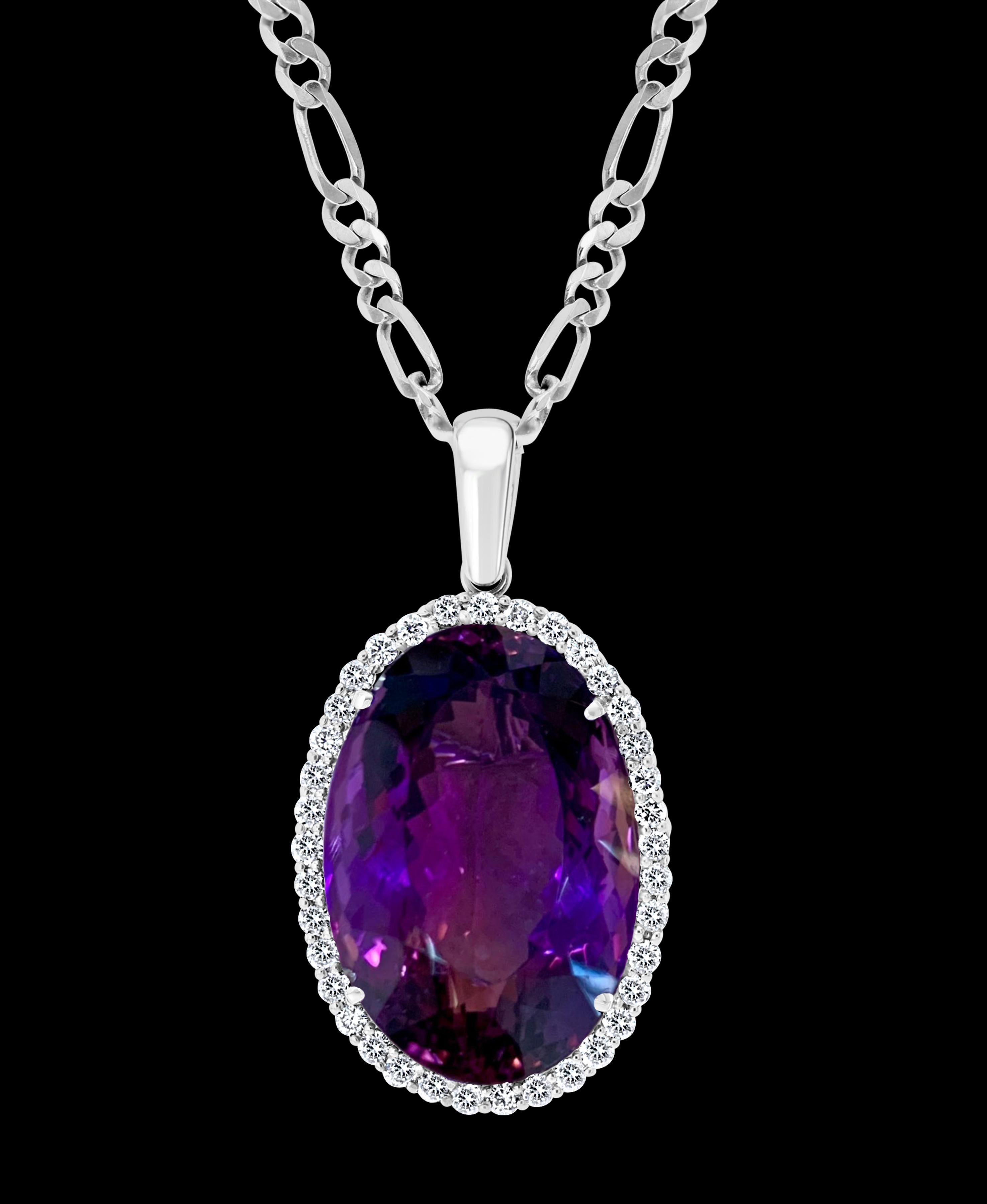   Approximately  78 Carat Amethyst & 3.5 Ct Diamond Pendant Necklace 14 Karat White Gold + Chain
This spectacular Pendant Necklace  consisting of a single large Oval Amethyst , approximately  78 Carat.  The  Amethyst   Has Circle of diamonds around