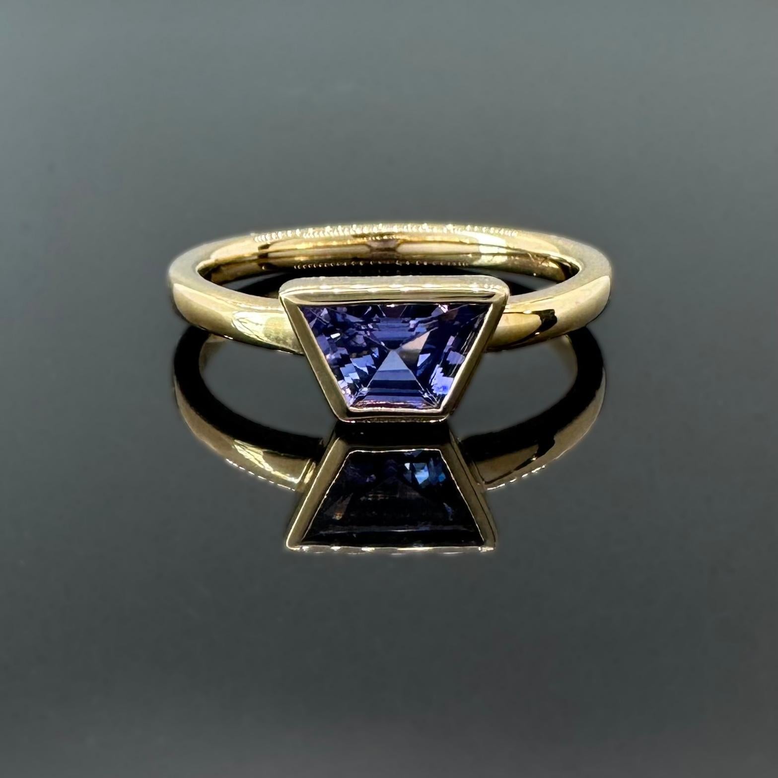 Trapezoid Cut .78 carat bezel set indigo/purple sapphire and 14k yellow gold ring by G&GS For Sale