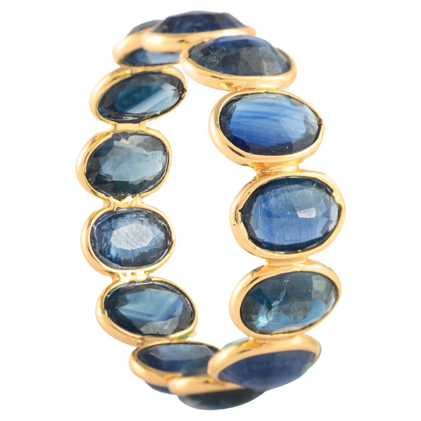 For Sale:  7.8 Carat Continual Oval Blue Sapphire Eternity Band Ring in 18k Yellow Gold