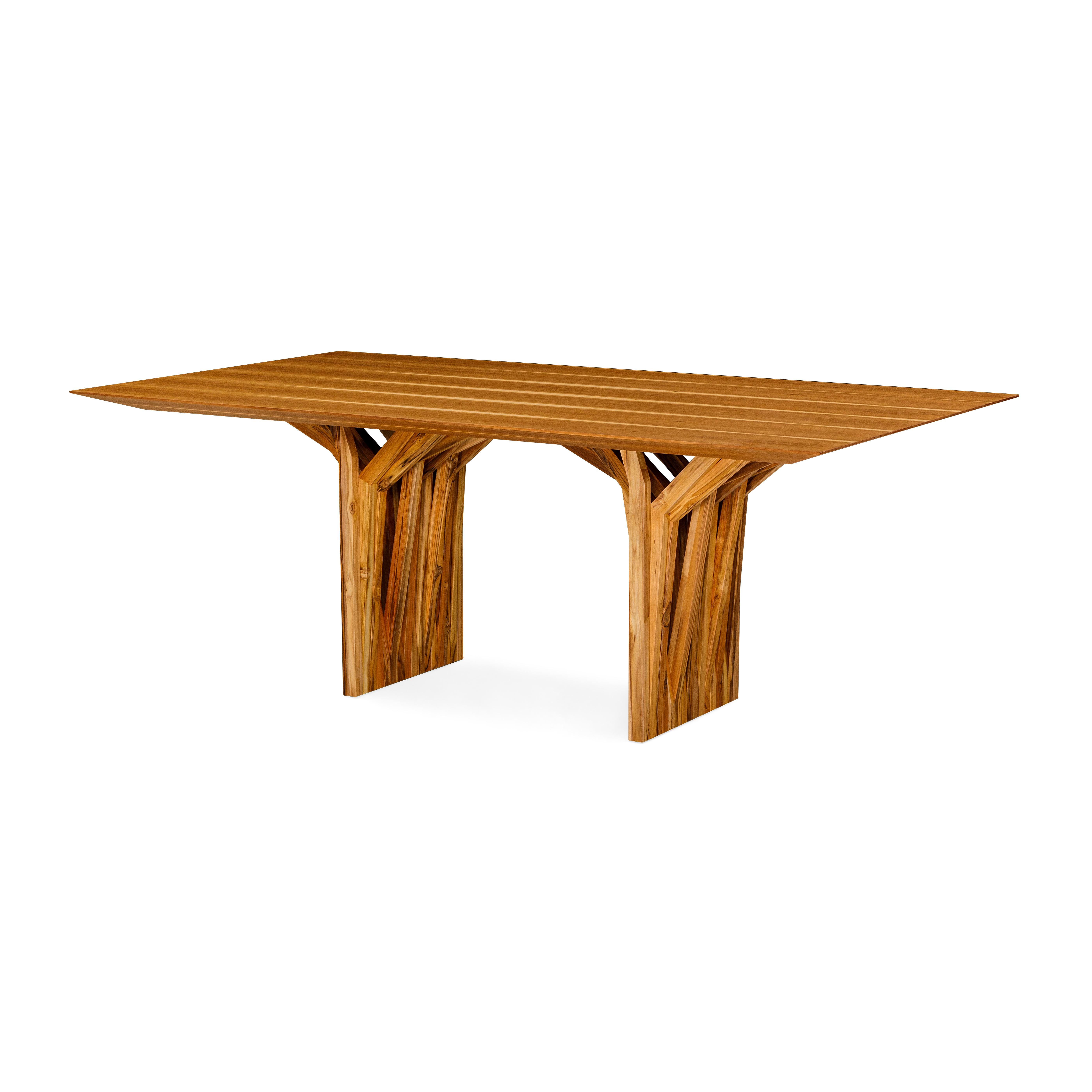 The Radi dining table is this masterpiece in a teak finish wood veneer top and an original roofing anchor table base, inspired by the aerial roots of trees. This dining table is a very simple piece that the Uultis team has created with materials and