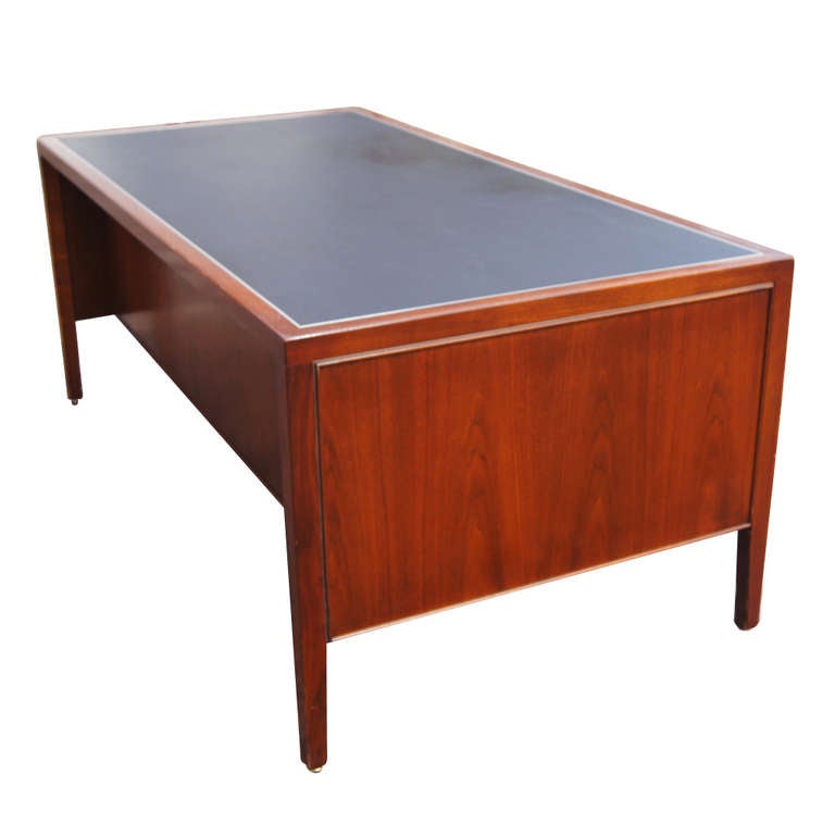 Known for superb quality, this Stow Davis desk is fit for any office or home office. The desk features one pencil drawer, four standards drawers, one file drawer, and a black lined leather top. Measures: 78