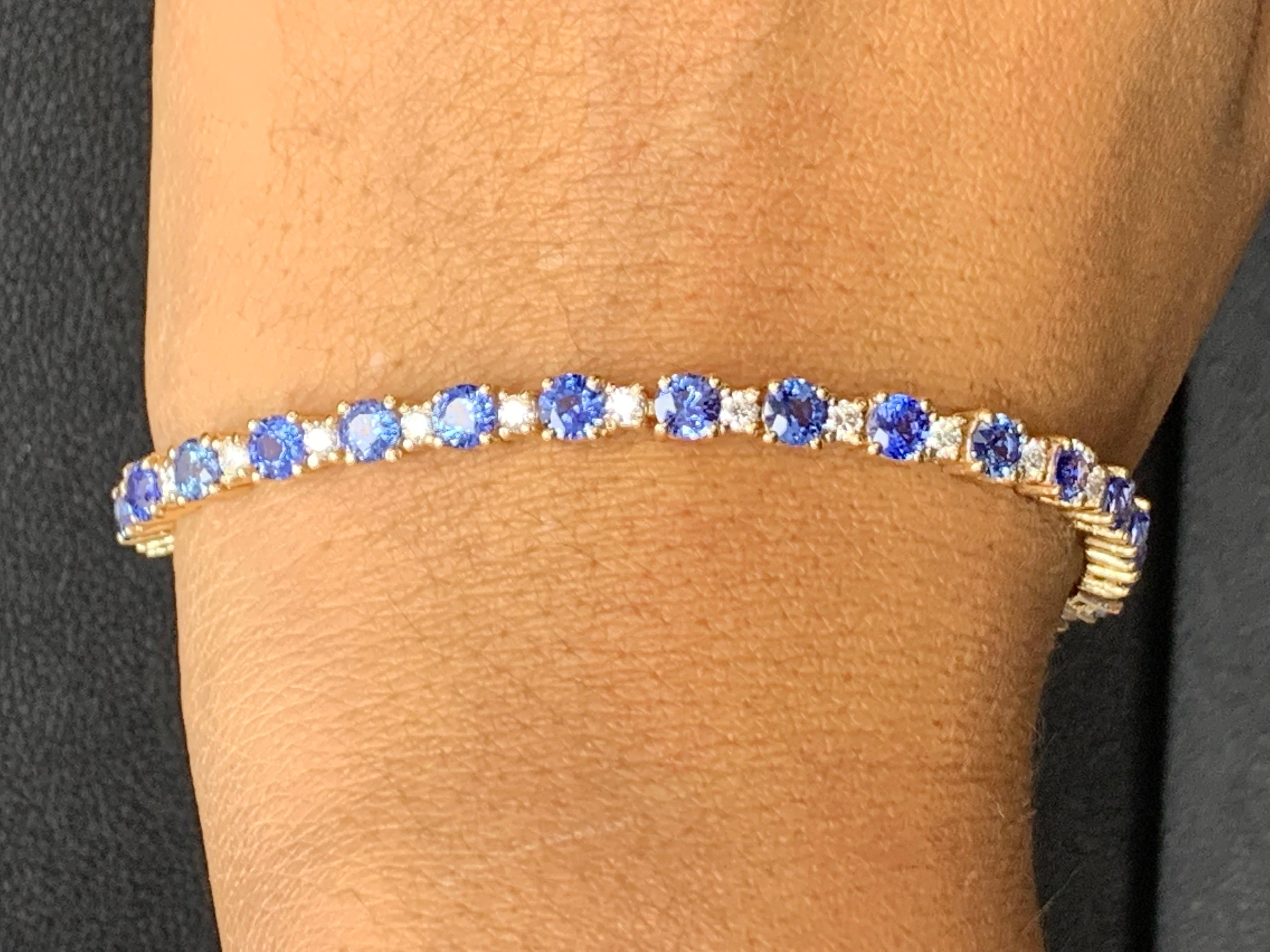 Showcasing 7.80 carats total of 28 blue sapphires, elegantly alternating with 1.40 carats of 28 round brilliant diamonds. Made in 14 karat yellow gold.

Style available in different price ranges. Prices are based on your selection of the 4C’s