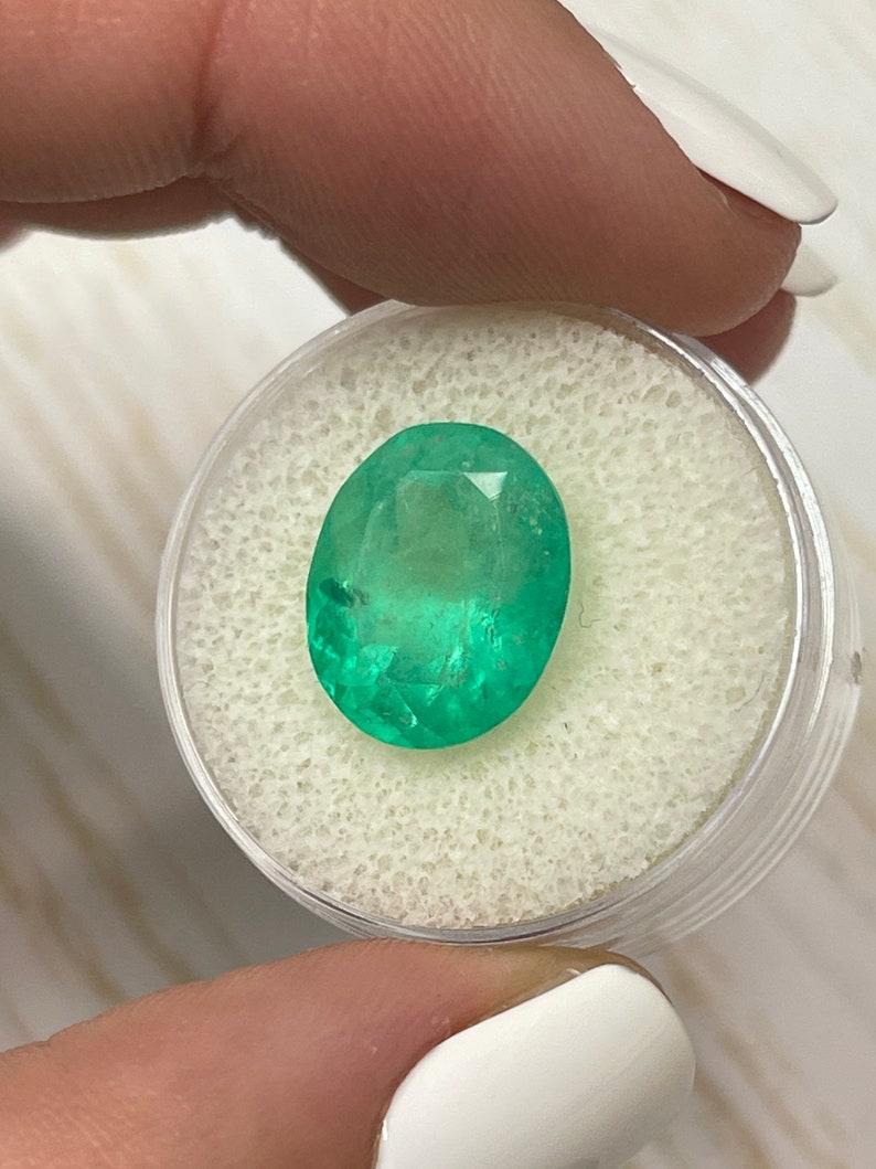Modern 7.80 Carat Yellowish Green Colombian Emerald Oval Cut - May Birthstone Gem For Sale
