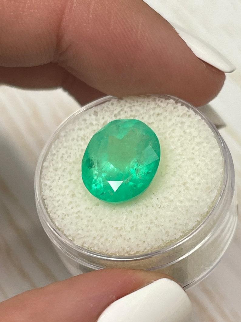 7.80 Carat Yellowish Green Colombian Emerald Oval Cut - May Birthstone Gem In New Condition For Sale In Jupiter, FL