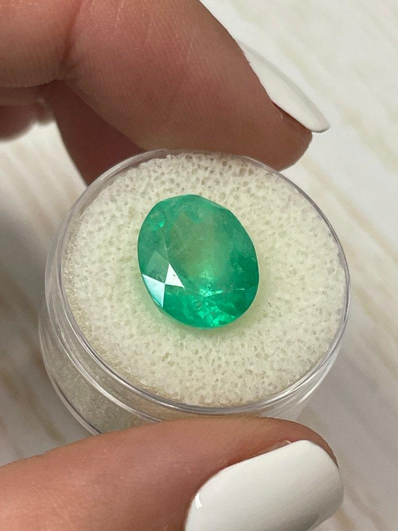 Women's or Men's 7.80 Carat Yellowish Green Colombian Emerald Oval Cut - May Birthstone Gem For Sale