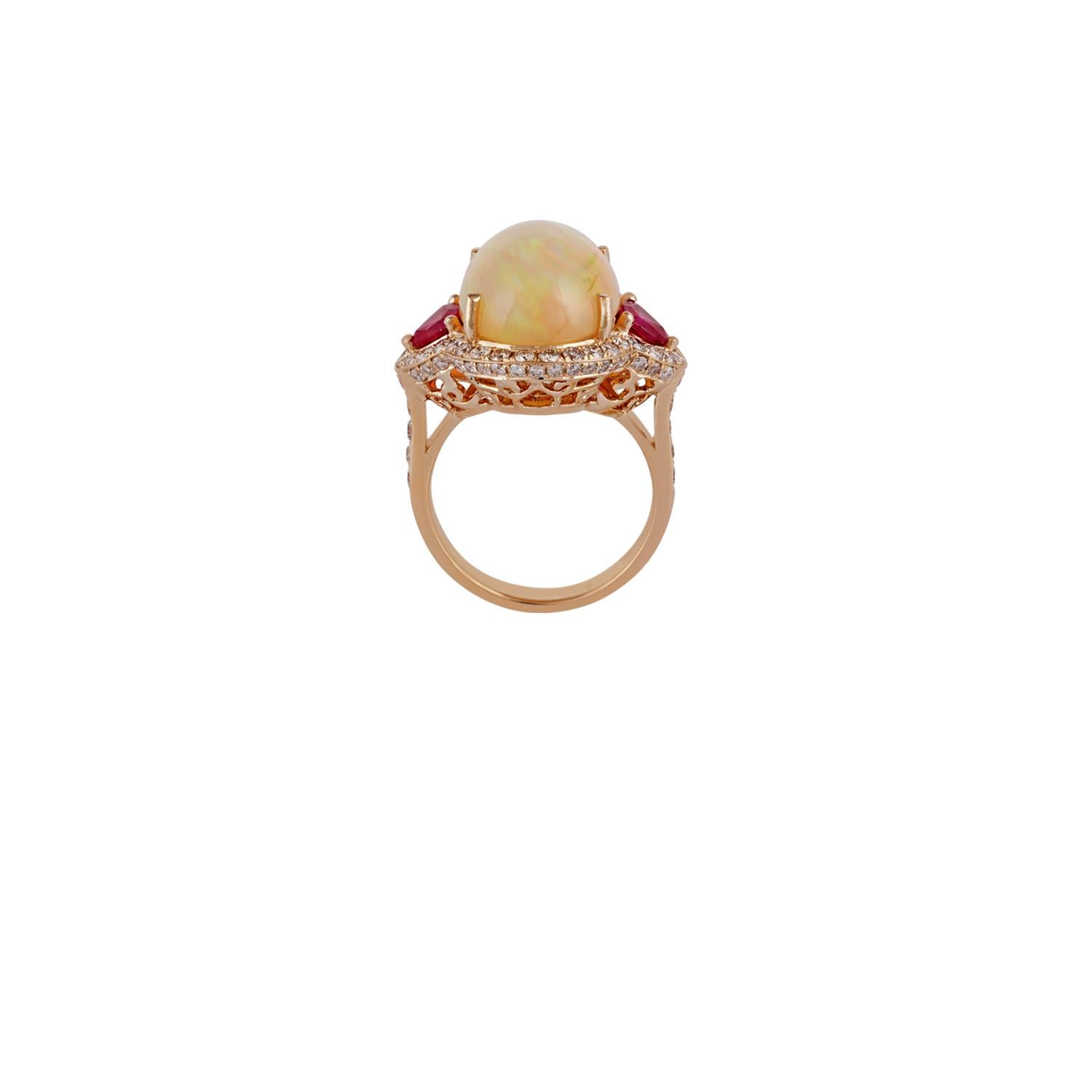This is an exclusive & designer ring studded in 18k yellow gold features 1 piece of opal weight 7.81 carat with 2 pieces of ruby weight 0.85 carat & 84 pieces of diamonds weight 1.18 carat, this entire ring is studded in 18k yellow gold weight 7.94