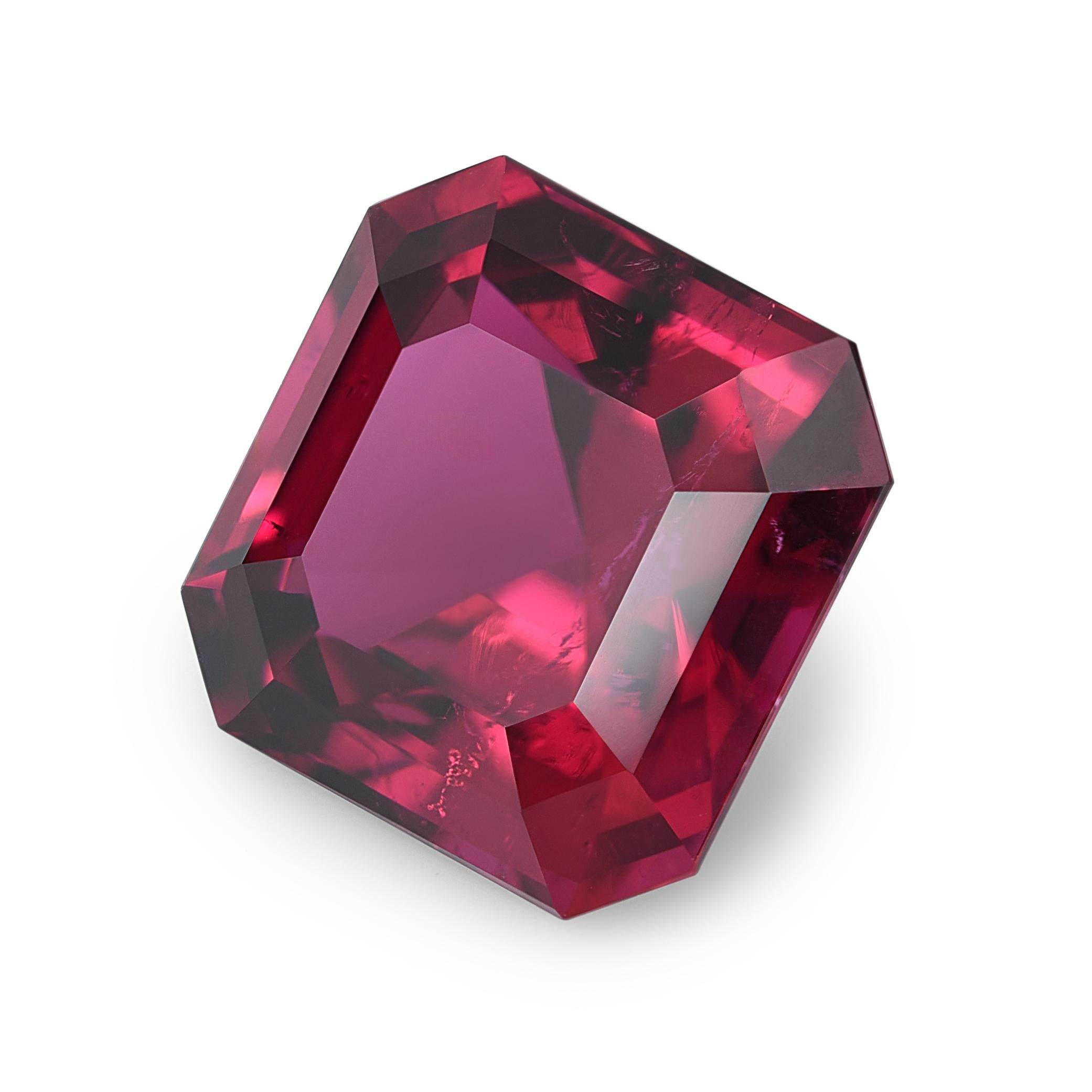 This exquisite Natural Red Tourmaline boasts a cushion cut, showcasing dimensions of 11.91 x 11.90 x 7.99 mm. With a substantial weight of 7.81 carats, this gemstone captivates with its vibrant red hue. The cushion cut, characterized by rounded