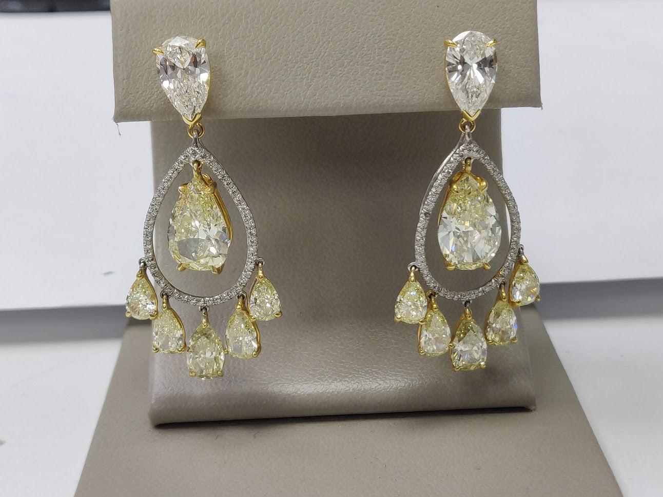 Title:
7.82 Carat Pear Shape Intense Fancy Yellow Diamond 18 Karat Two Tone Gold Drop Earrings


Style:
Drop


Metal:
18 Karat Two Tone Gold


Gemstone 1:
5.6 Carat Diamond


Number of Stones:
8


Shape:
Pear Shape


Gemstone 2:
1.2 Carat