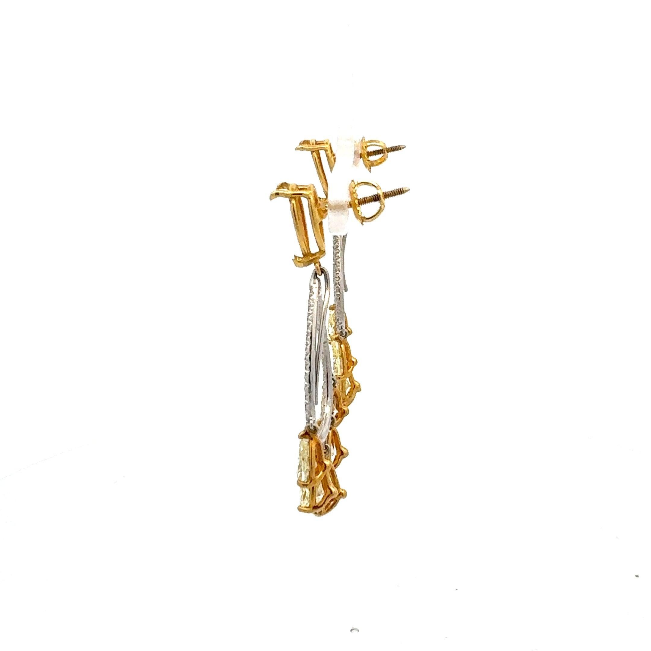 Contemporary 7.82 Carat Pear Shape Intense Fancy Yellow Diamond 18K Gold Drop Earrings For Sale
