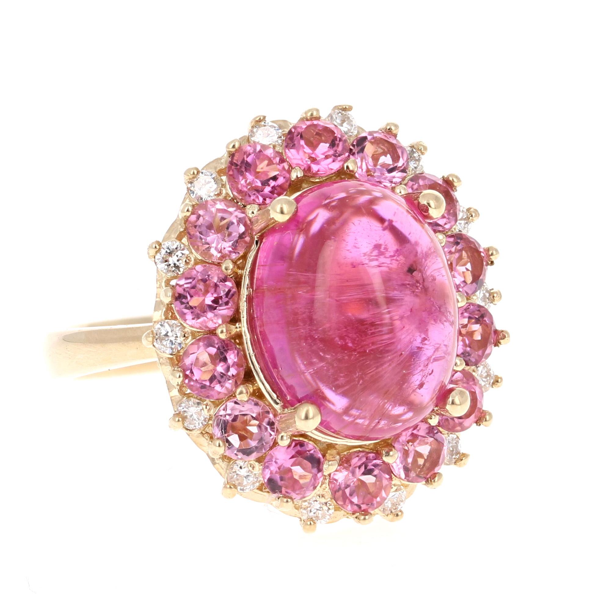 Stunning and uniquely designed 7.82 Carat Pink Tourmaline and Diamond Yellow Gold Cocktail Ring! 

This ring has a 6.09 carat Oval Cut Cabochon Pink Tourmaline that is set in the center of the ring and is surrounded by 14 Round Cut Pink Tourmalines