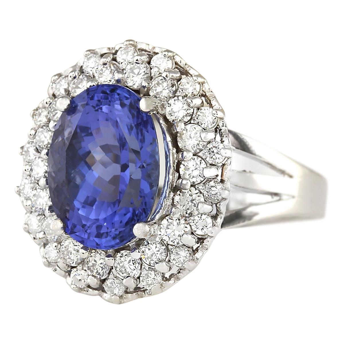 Discover elegance with our 7.82 Carat Tanzanite Ring, expertly crafted in 14K White Gold. The centerpiece of this luxurious piece is a mesmerizing tanzanite, weighing 6.62 carats and measuring 12.00x10.00 mm. Adorned with sparkling diamonds totaling