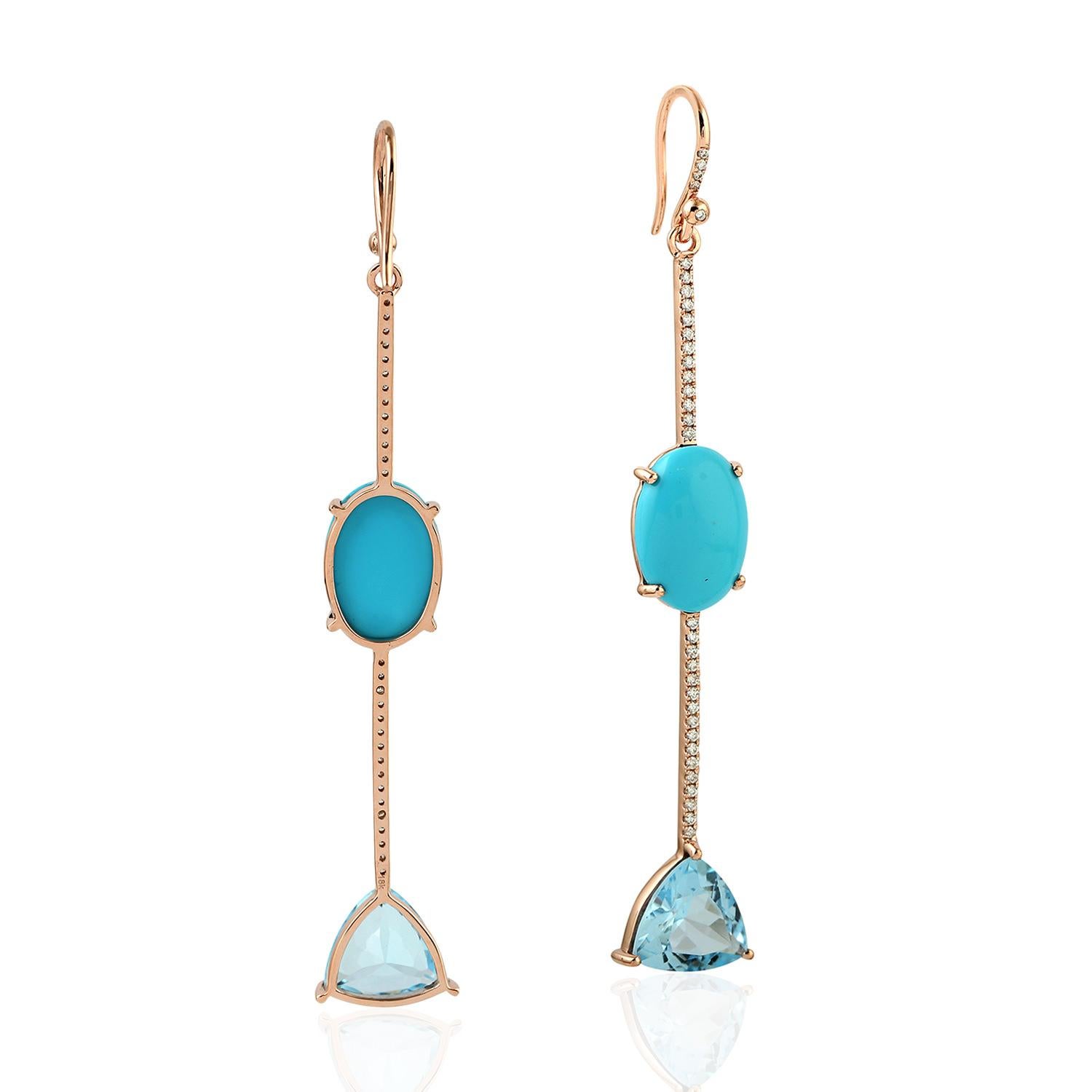 These beautiful linear drop earring are handmade in 18-karat gold. It is set with 7.82 carats turquoise, 7.05 carats topaz and .37 carats glimmering diamonds.

FOLLOW  MEGHNA JEWELS storefront to view the latest collection & exclusive pieces. 