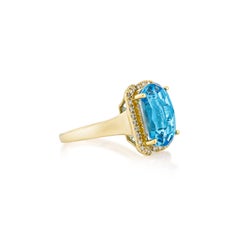 Sunita Nahata Swiss Blue Topaz 7.83ct. Fancy Ring in 18KYG with Diamond.