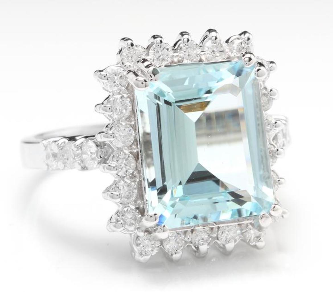 7.85 Carats Natural Aquamarine and Diamond 14K Solid White Gold Ring

Total Natural Emerald Cut Aquamarine Weights: Approx. 6.80 Carats

Aquamarine Measures: Approx. 12 x 10mm

Aquamarine Treatment: Heat

Natural Round Diamonds Weight: Approx. 1.05