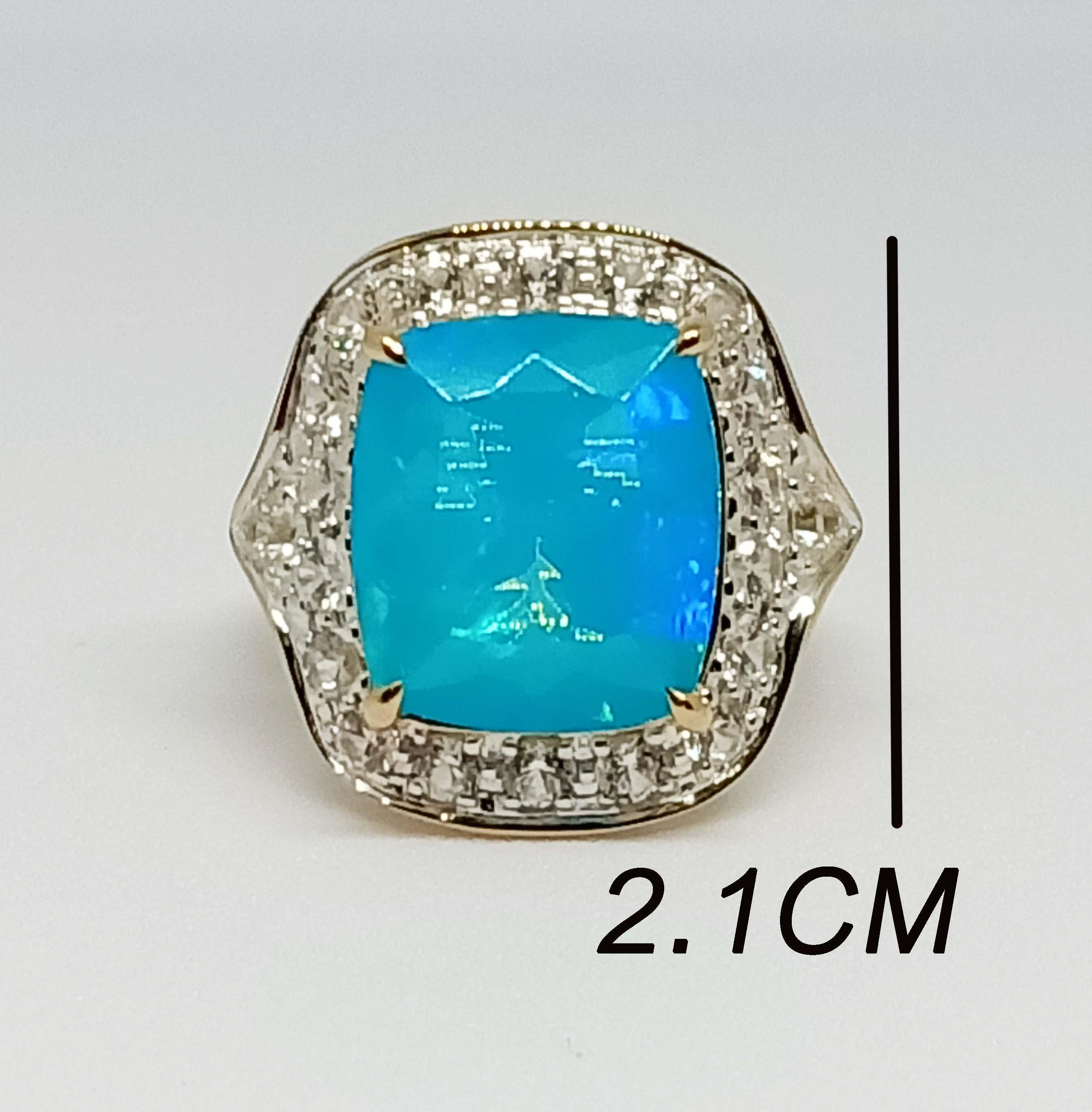 Blue Opal cushion 14.1x12.5mm. (7.85cts)
White zircon Round 2.7 mm. 6 pcs.
White zircon Round 2.5 mm. 14 pcs.
Sterling Silver in 18K Gold Plated.
Size ring 7 us.

