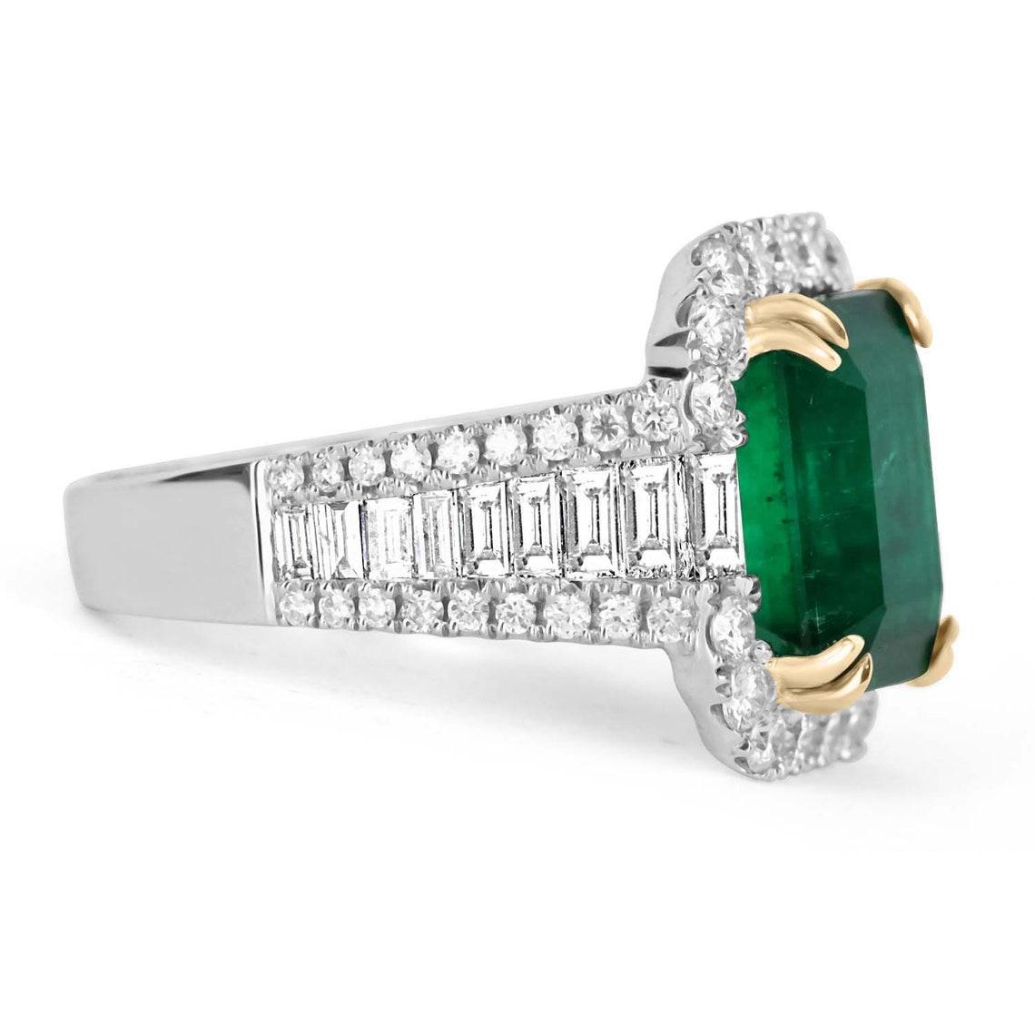 An exceptional Colombian emerald & diamond statement/anniversary ring. This fine quality ring is captivating from every angle. Incredible diamonds highlight the emerald, shank, and gallery of the ring. The emerald has vivid, vivacious green color