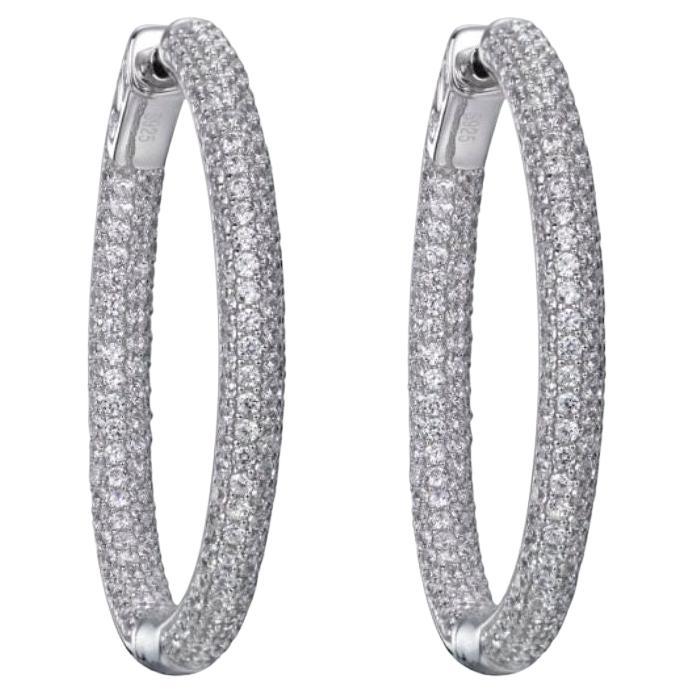 A twist on the wardrobe staple, these shimmering hoop earrings will add a sparkling statement to any occasion.

Featuring 7.86ct of round brilliant cuts, claw set in 925 sterling silver with a high gloss white rhodium finish.

Dimensions: 35mm drop