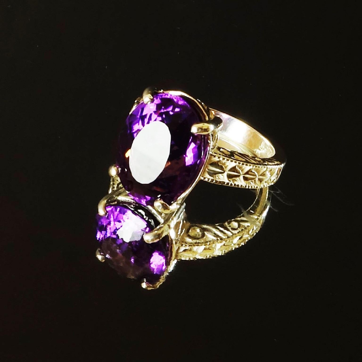 Custom made, sparkling oval Amethyst in engraved Sterling Silver Ring.  This handsomely engraved shank sets off the brilliant Brazilian gemstone.  This unique Amethyst flashes pink and purple and is so lively it almost jumps off your hand.  It is
