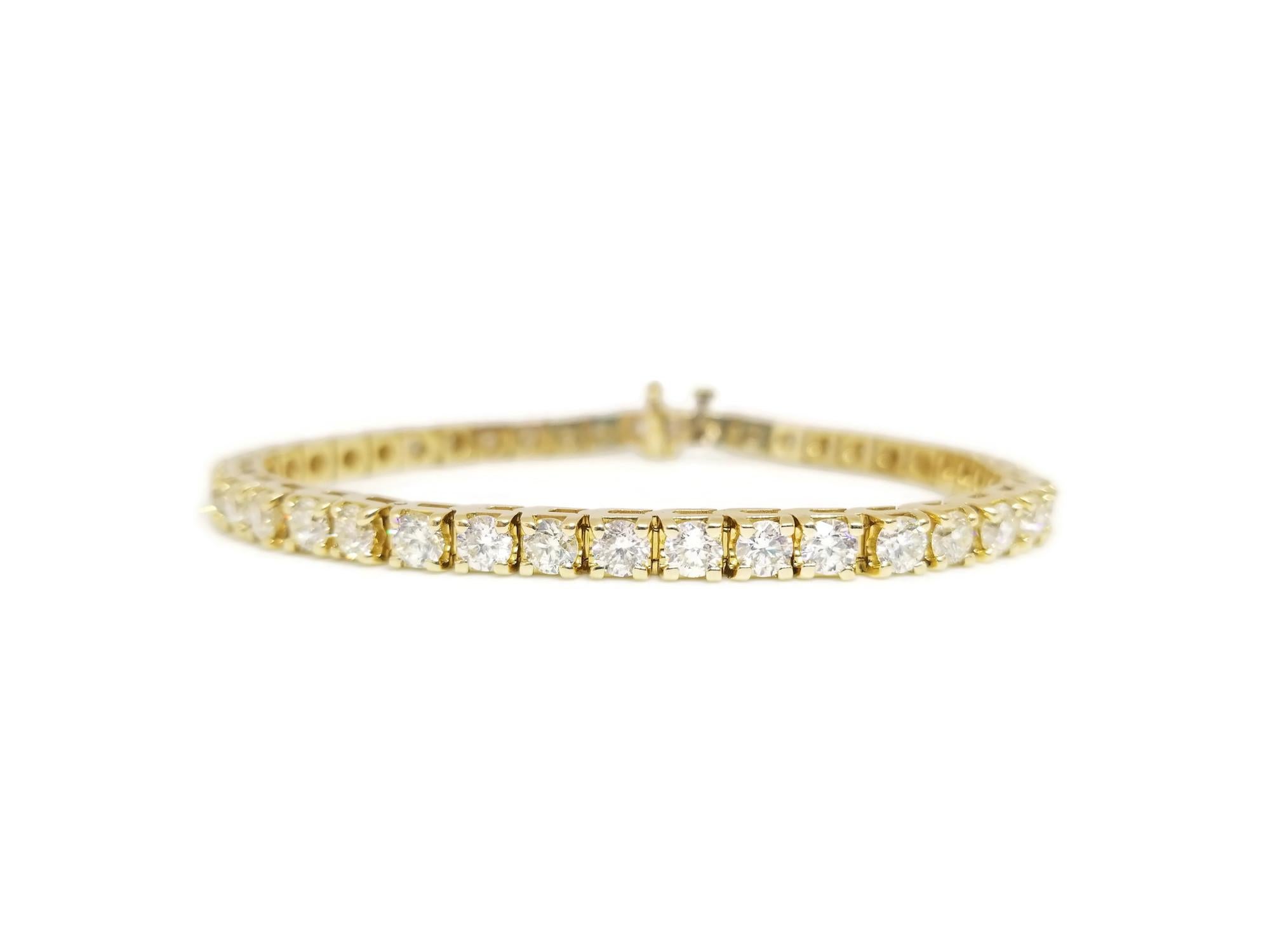 Quality tennis bracelet, containing 42 pcs of natural round-brilliant cut diamonds. set on 14k yellow gold. each stone is set in a classic four-prong style for maximum light brilliance. 7 inch length. Color H-I, Clarity VS-SI. 4mm Wide.