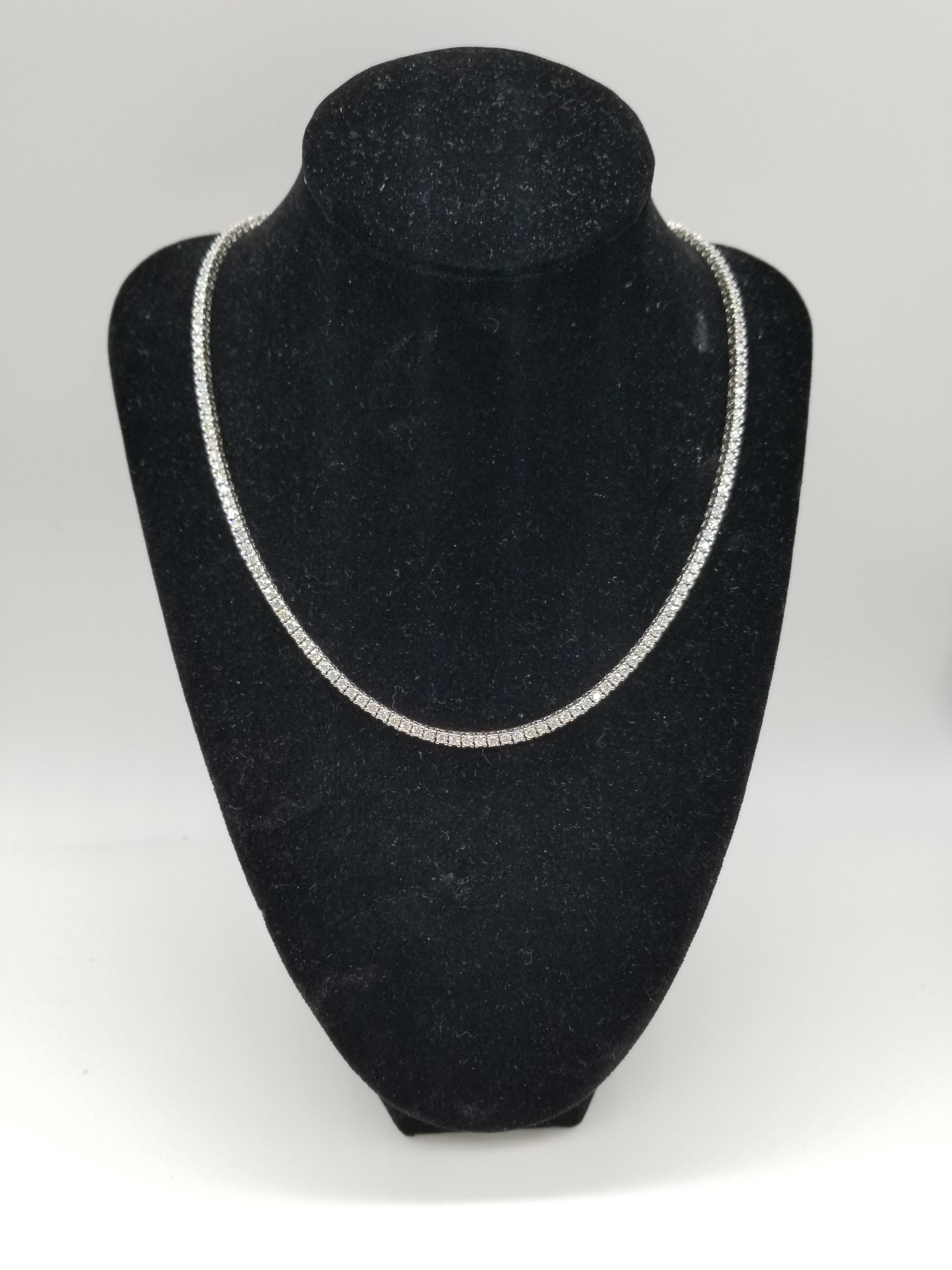 Elegantly simple. Beautiful jewelry 14 Karat White Gold Round Brilliant Cut Diamond Tennis Necklace set on 4 prong setting. The total diamond weight is 7.86 ctw. The closure is an insert clasp with safety clasp. Length is 17.5 inches. H Color, VS