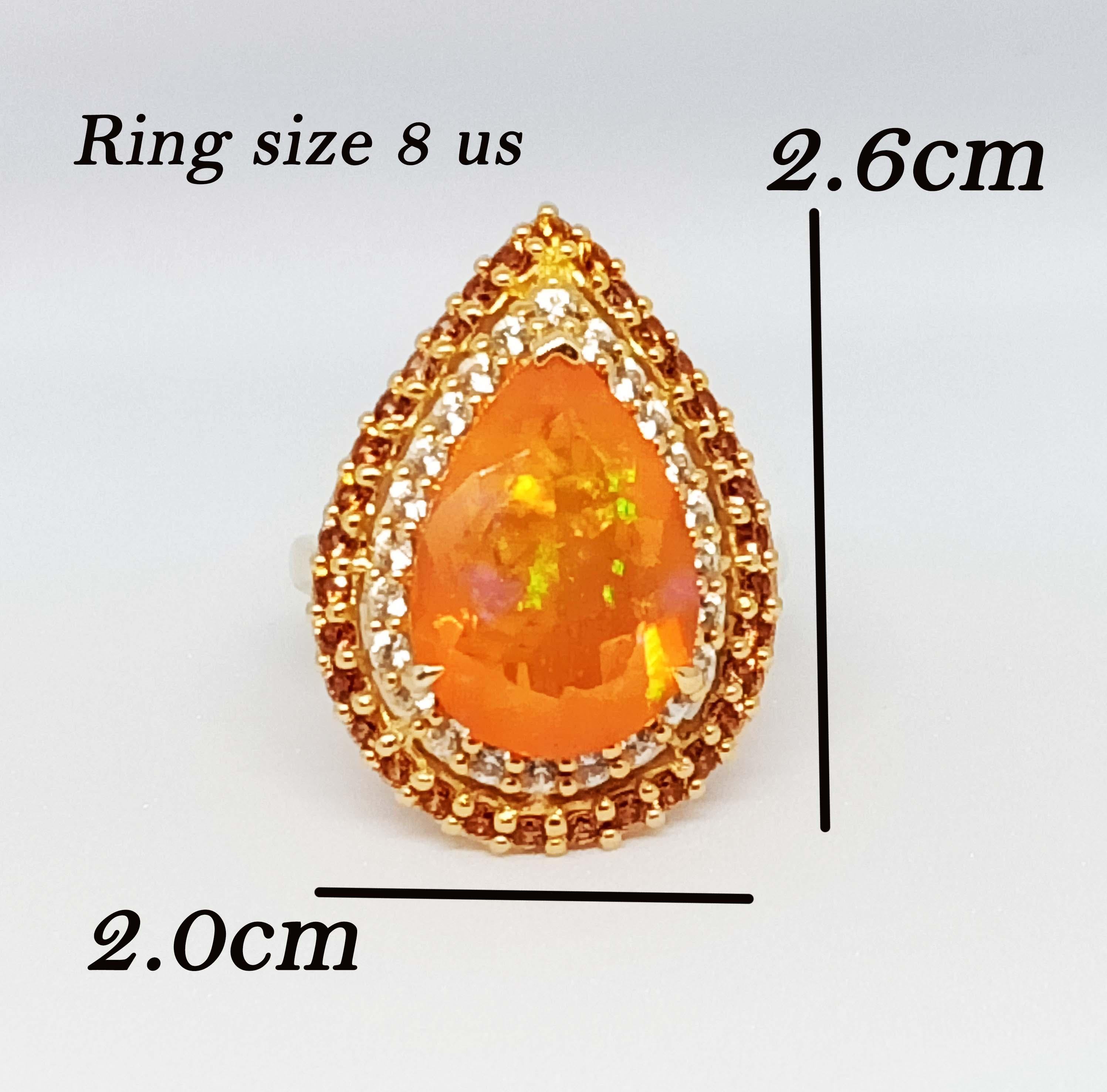Orange Opal       Pear 17.2x12 mm.  7.86 cts.
Orange sapphire Round. 1.8 mm. 33 pcs.
White Zircon        Round. 1.8 mm. 24 pcs.

Sterling Silver on 18K gold Plated.

Ring : Size 8 usa.


