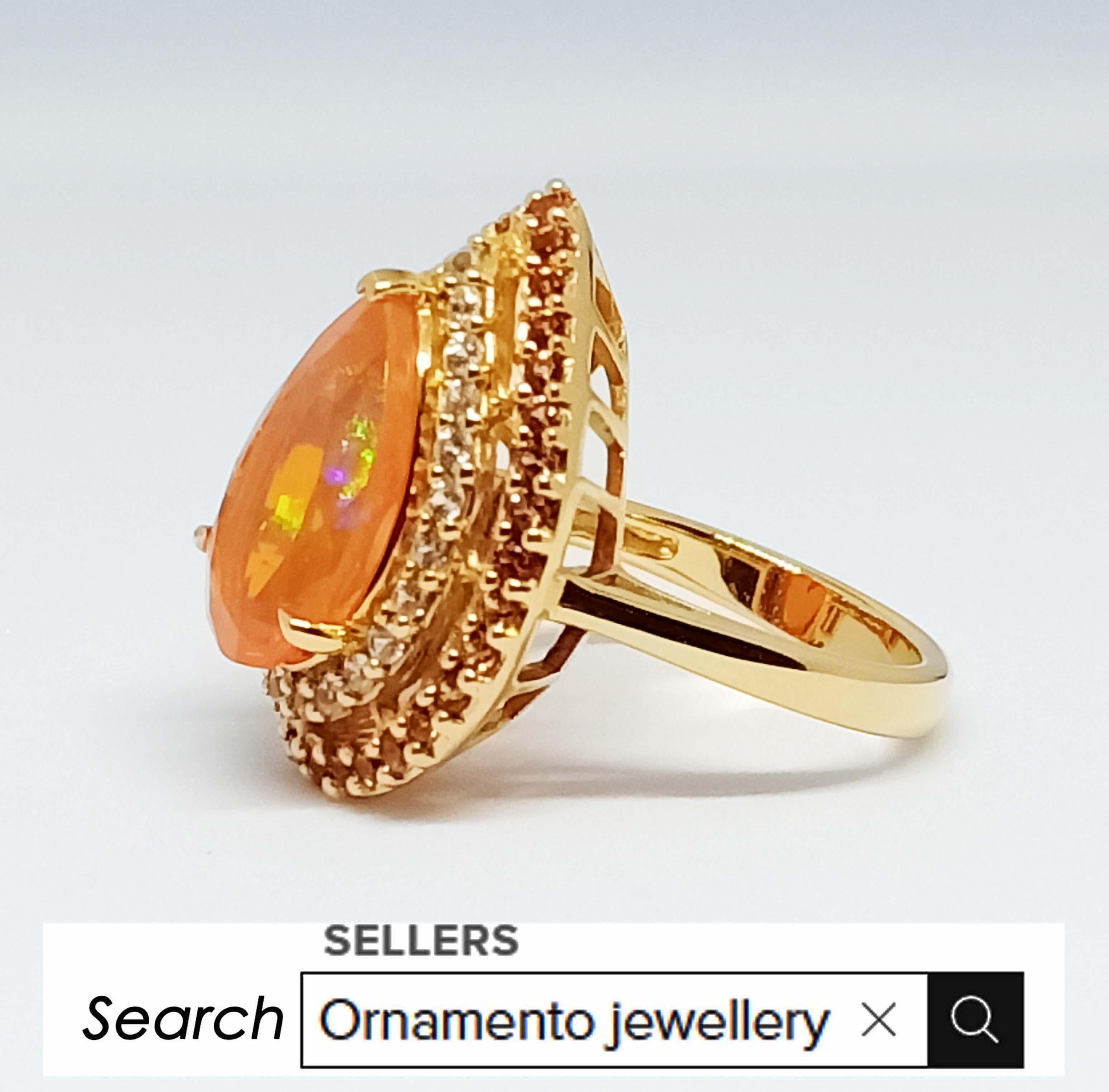 Contemporary 7.86cts. Orange Opal Ring. Sterling Silver 18k gold Plated. For Sale