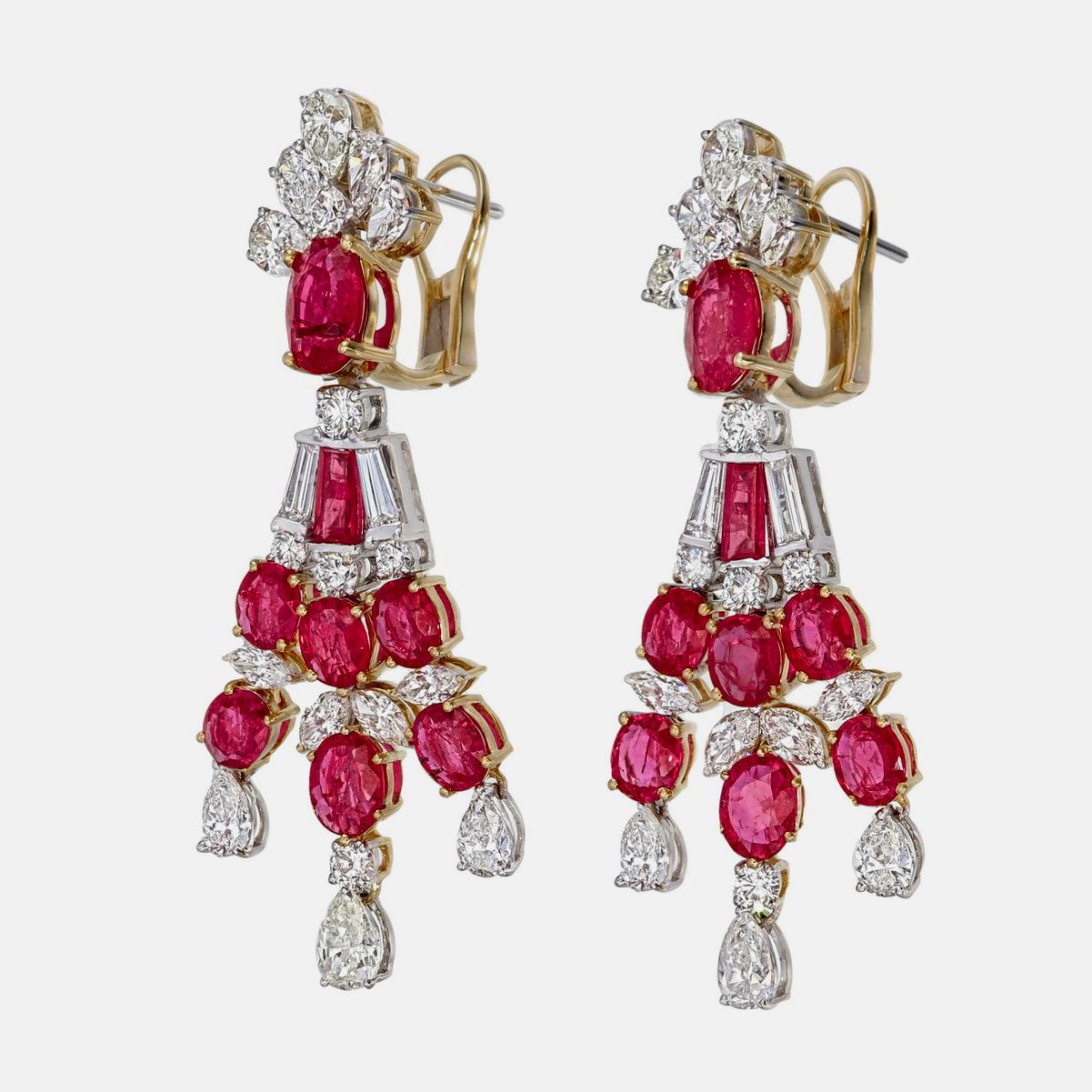 A vibrant and sophisticated ruby and diamond chandelier earrings presented to you by Rewa jewels in 18 karat white gold.

This piece is decorated with 14 pieces of Mozambique  rubies weighing approximately 7.08 carat total and 2 pieces of baguette