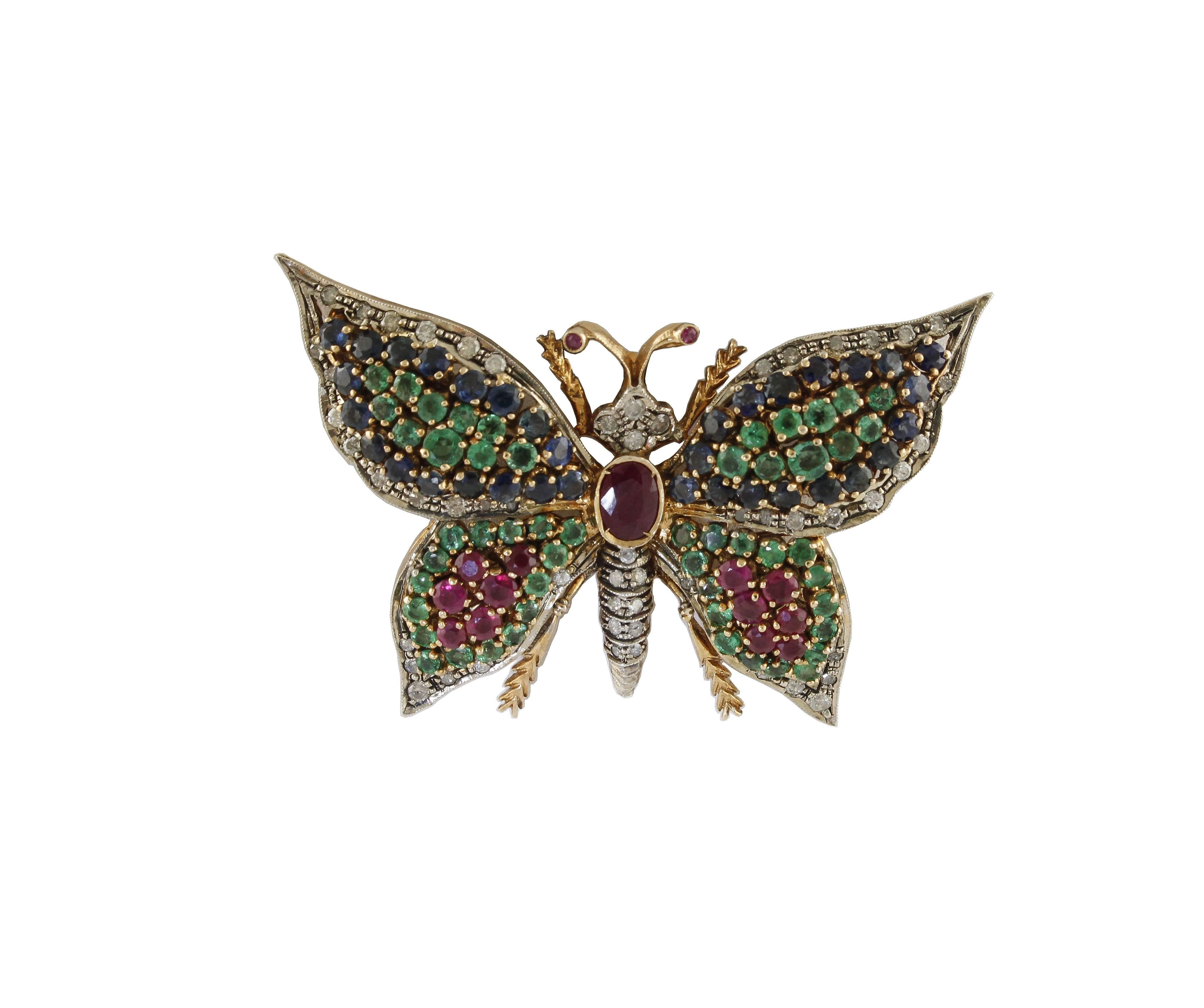 Amazing 9k gold and silver butterfly pendant necklace/ brooch  mounted with diamonds, rubies, emeralds, blue sapphires.
Diamonds 1.28 ct
Rubies, Emeralds, Blue Sapphires 7.88 ct 
Tot.Weight 22.20 g
R.F ffhh 

For any enquires, please contact the