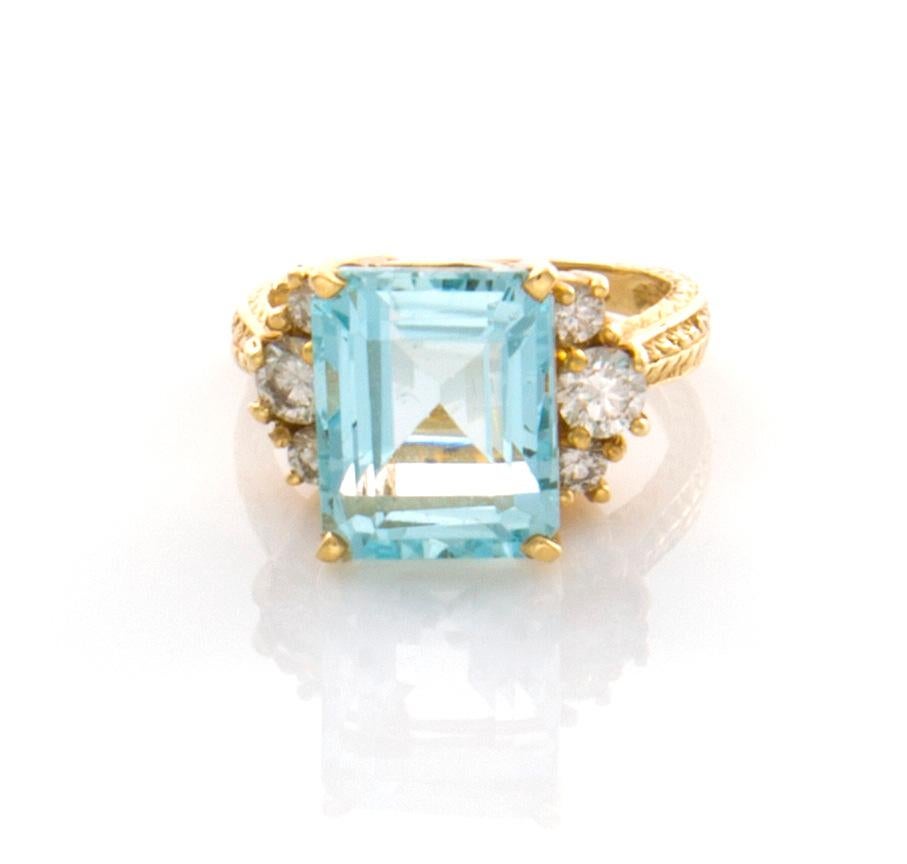 Diamond Weight: Total natural diamond weight is .75 carat. Excellent VS2 clarity / F-G color 
Gemstone Weight: Total  Natural Blue Aquamarine Weight is 7.13 Carat (Measures) : 12.05mm x 9.80mm Stamped:14k
14 Karat Yellow Gold
Ring Size: 6.25 
Total
